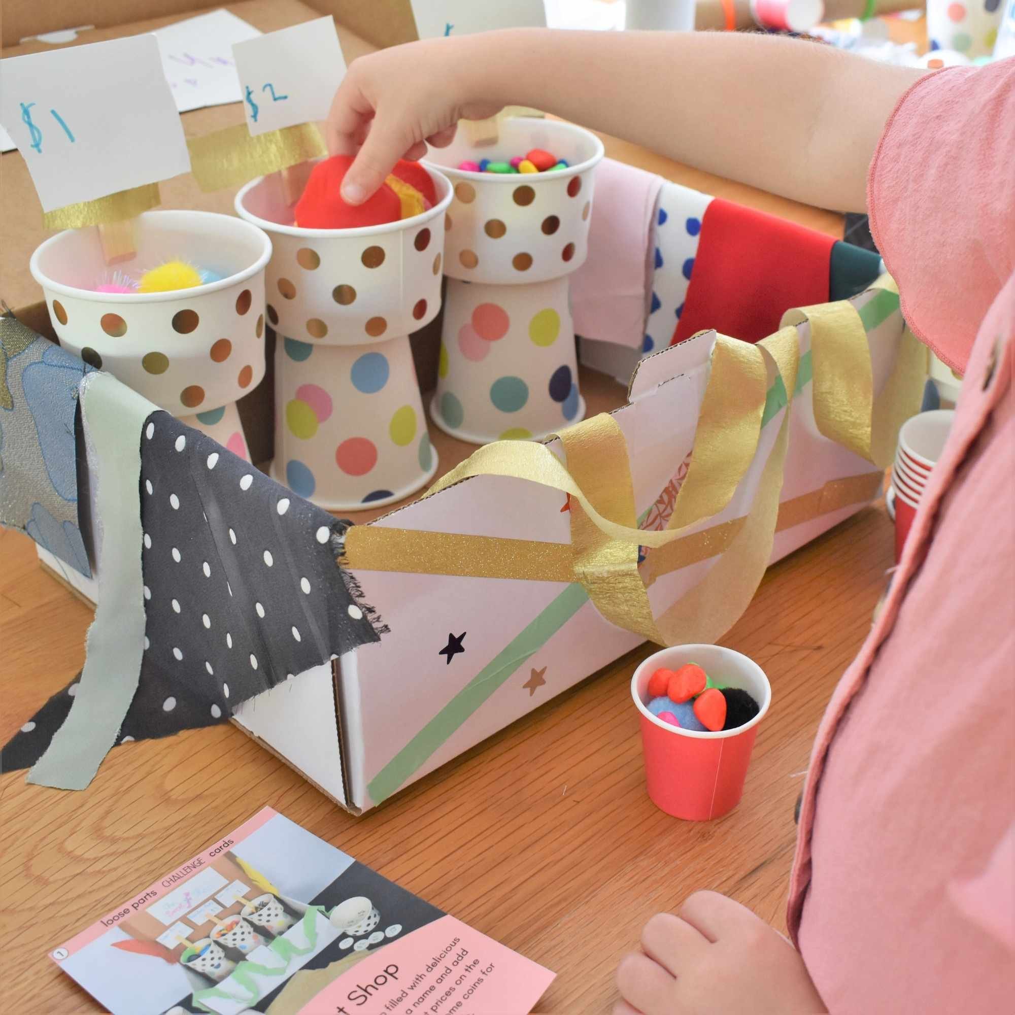 Loose parts challenge box being played with.jpg