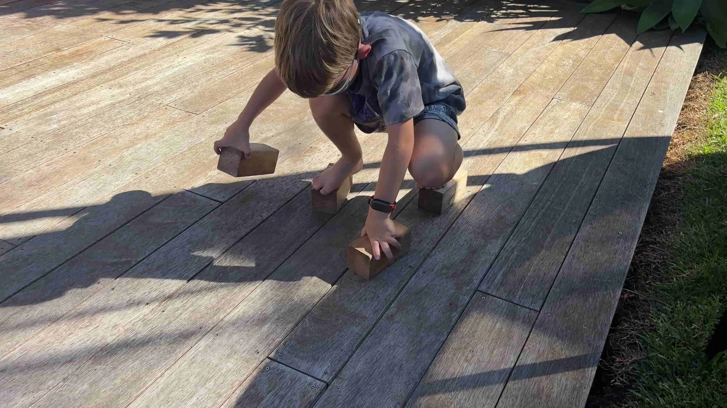 Child moving blocks as they move along