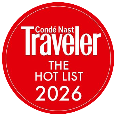Red circular badge with white text reading 'Condé Nast Traveler The Hot List 2026'.