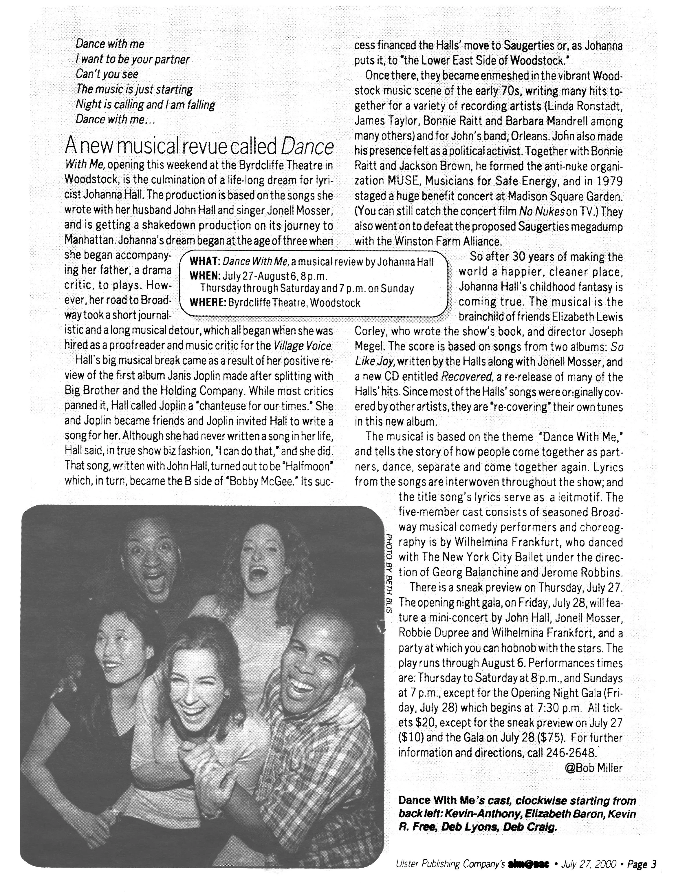 Black-and-white photograph of five diverse people smiling and posing closely together, with a woman in the center hugging a man, and the others smiling around them.