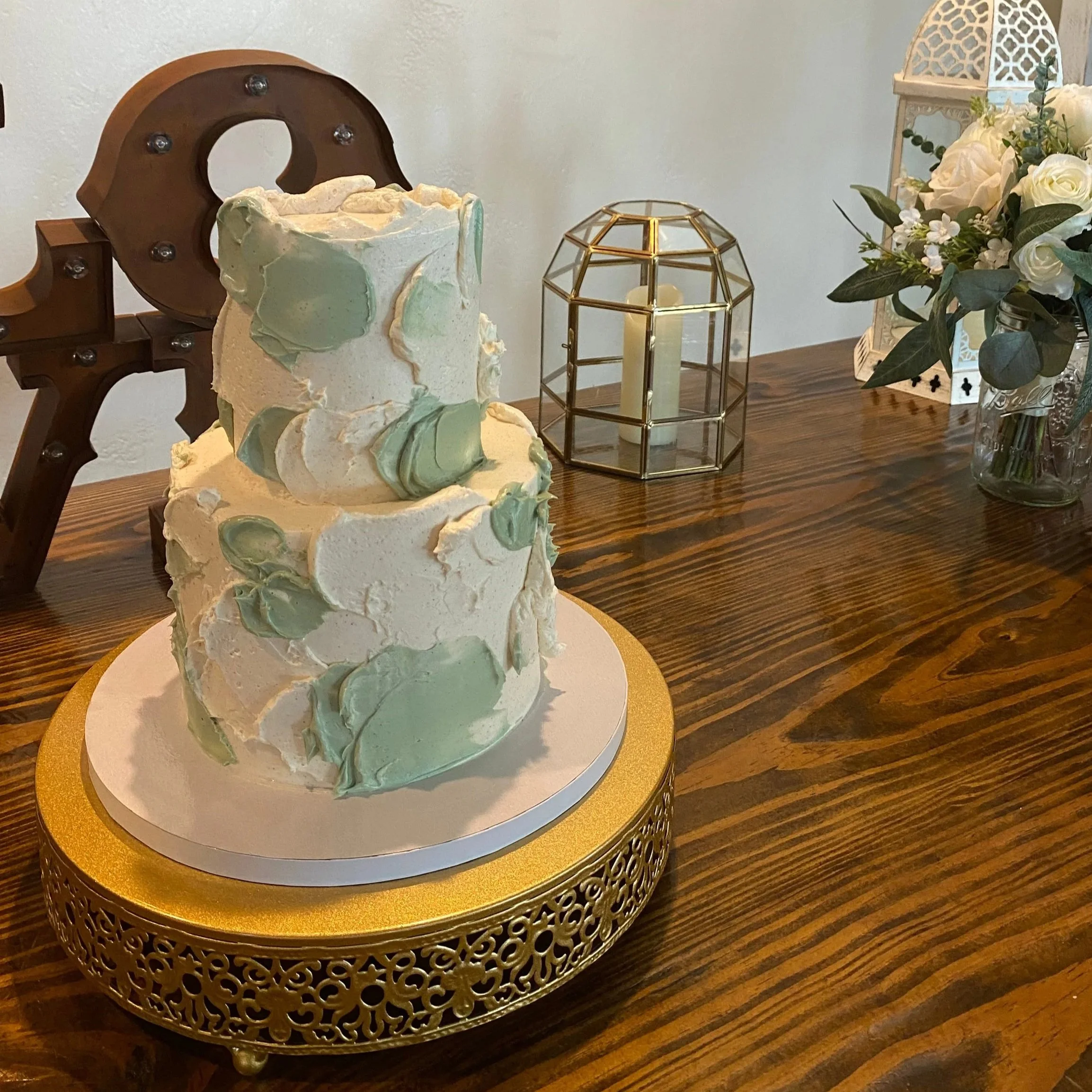 6” + 4” tiered cake with rustic green deco.jpg