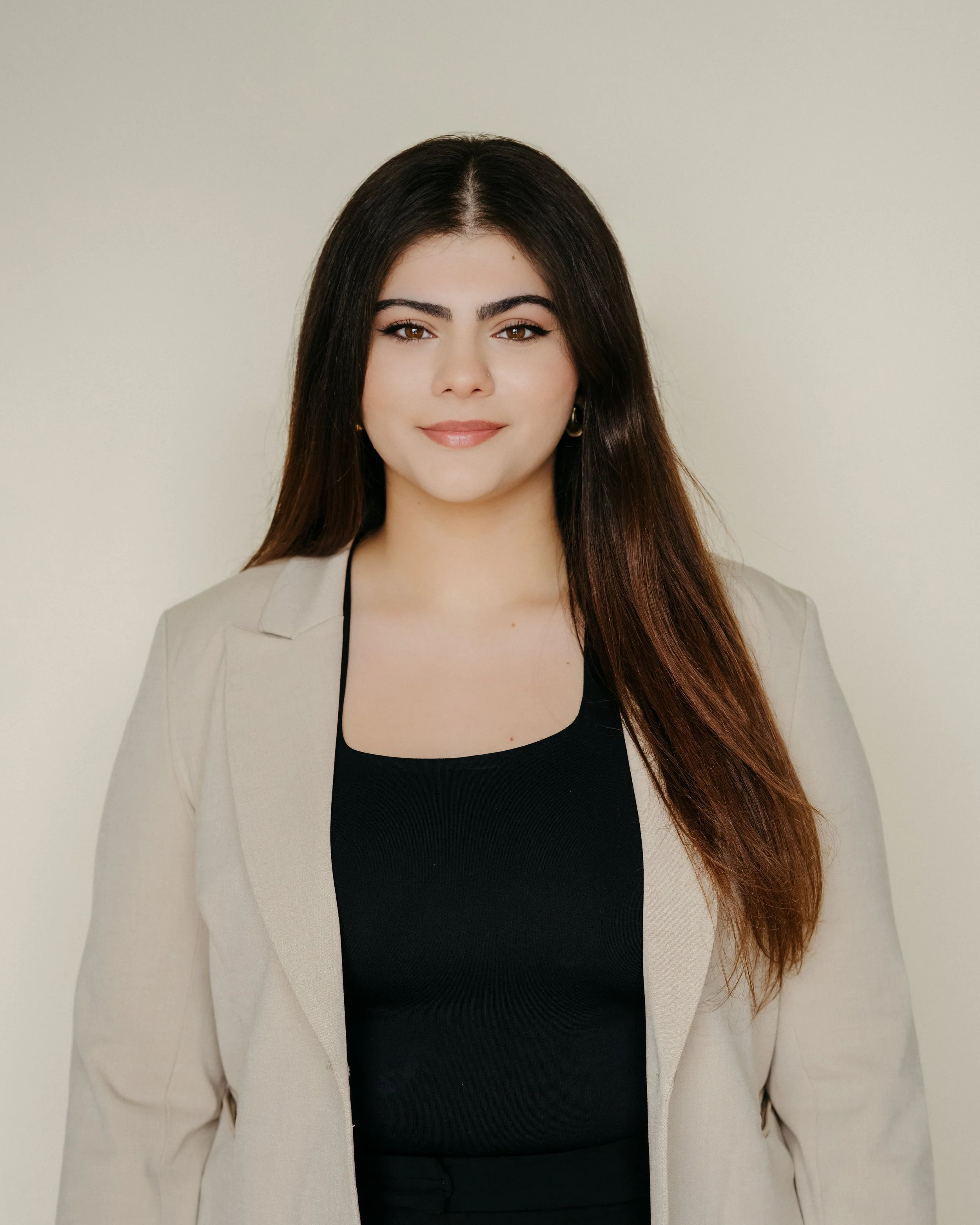 A headshot of Sara Koussan, office manager and administrator of Mint Legal in Calgary, Alberta.