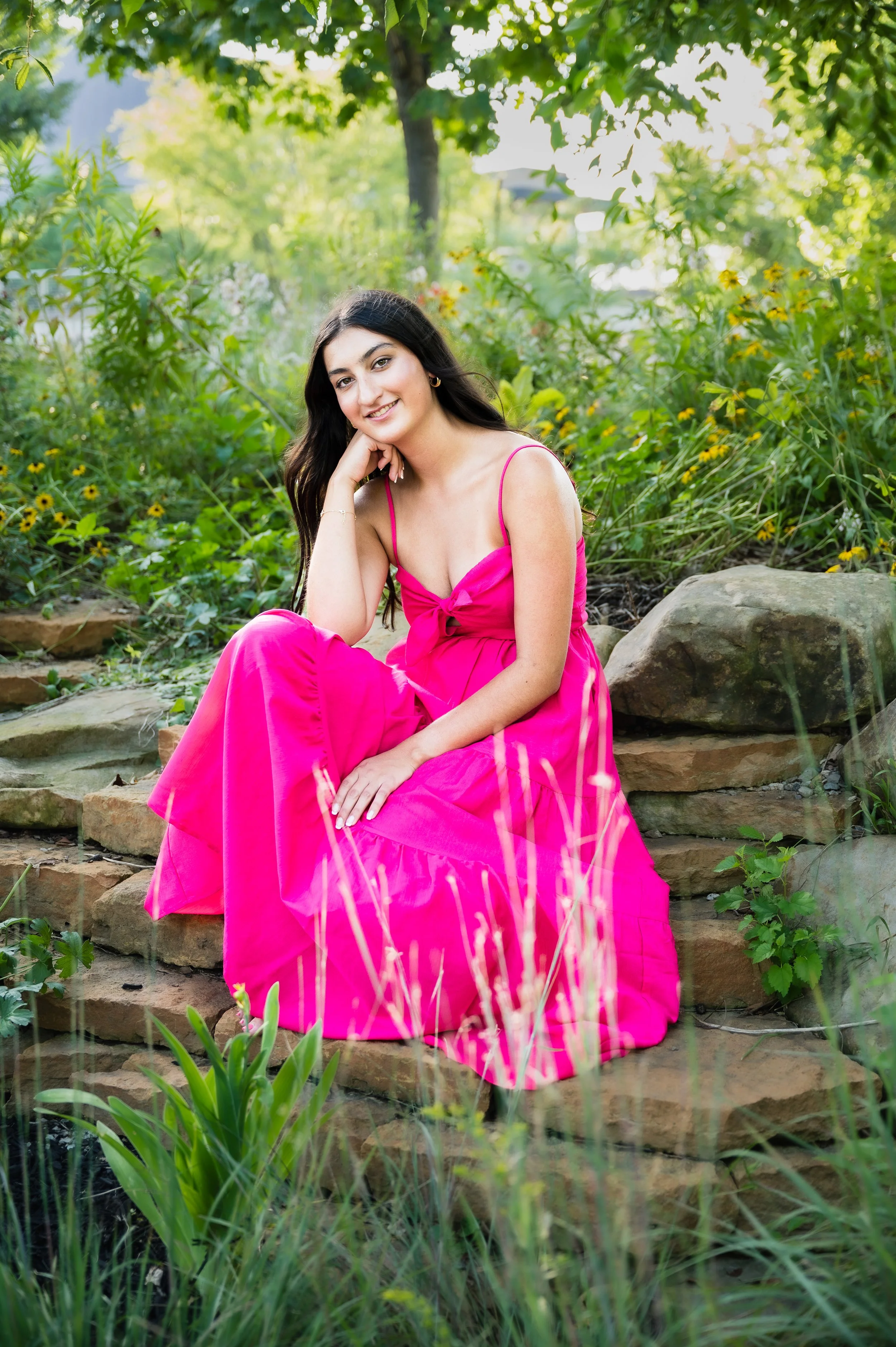 Girl in Bright pink dress natural background background