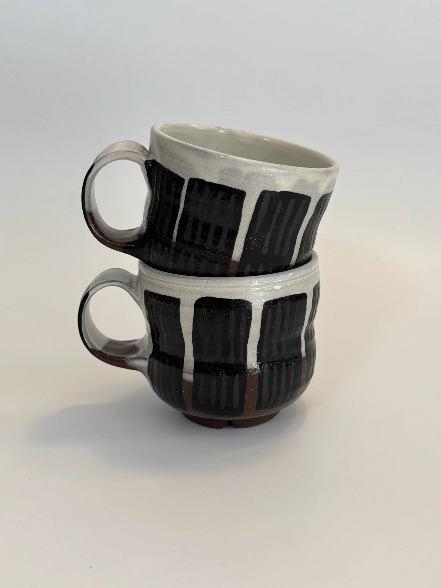 set of black and brown espresso mugs