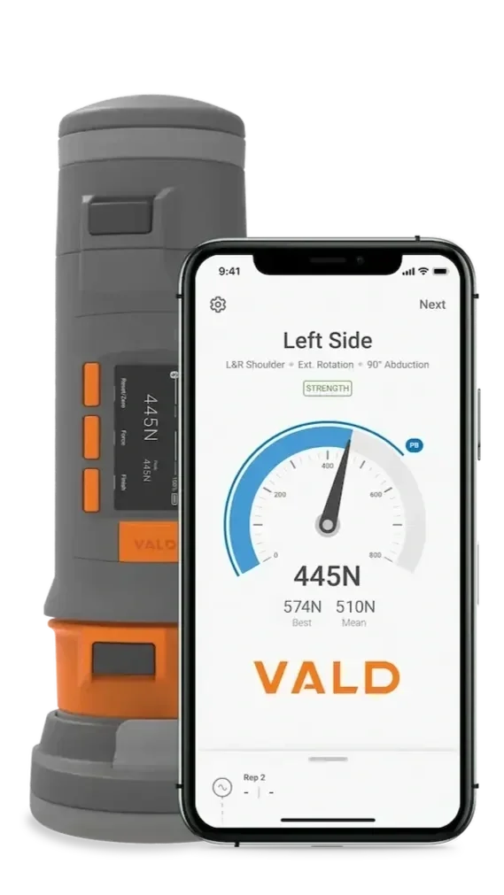 A portable digital muscle tester device displaying a 445 newton strength measurement on its screen, with an accompanying smartphone app showing detailed readings and analysis.