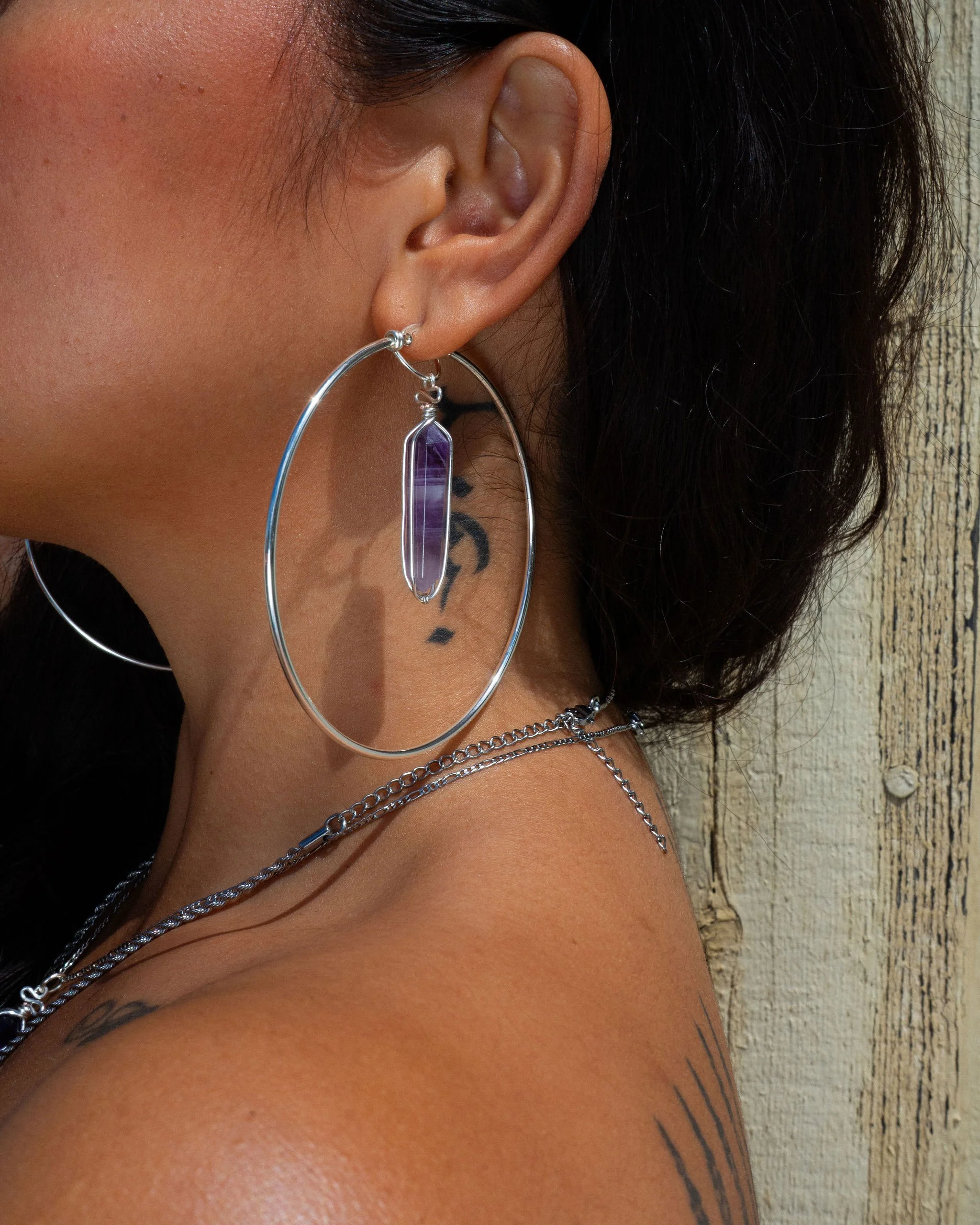 Novel (large silver Goddess Hoops)