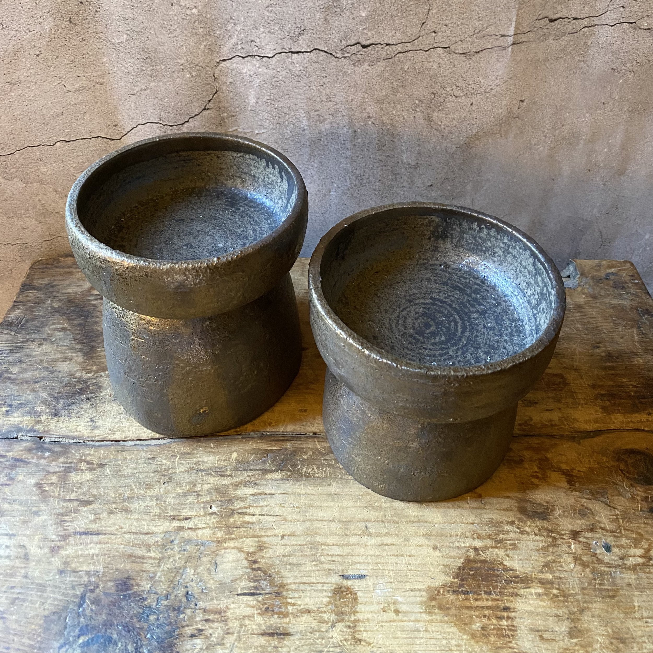 Unearthed handmade ceramic candlestick holders in bronze