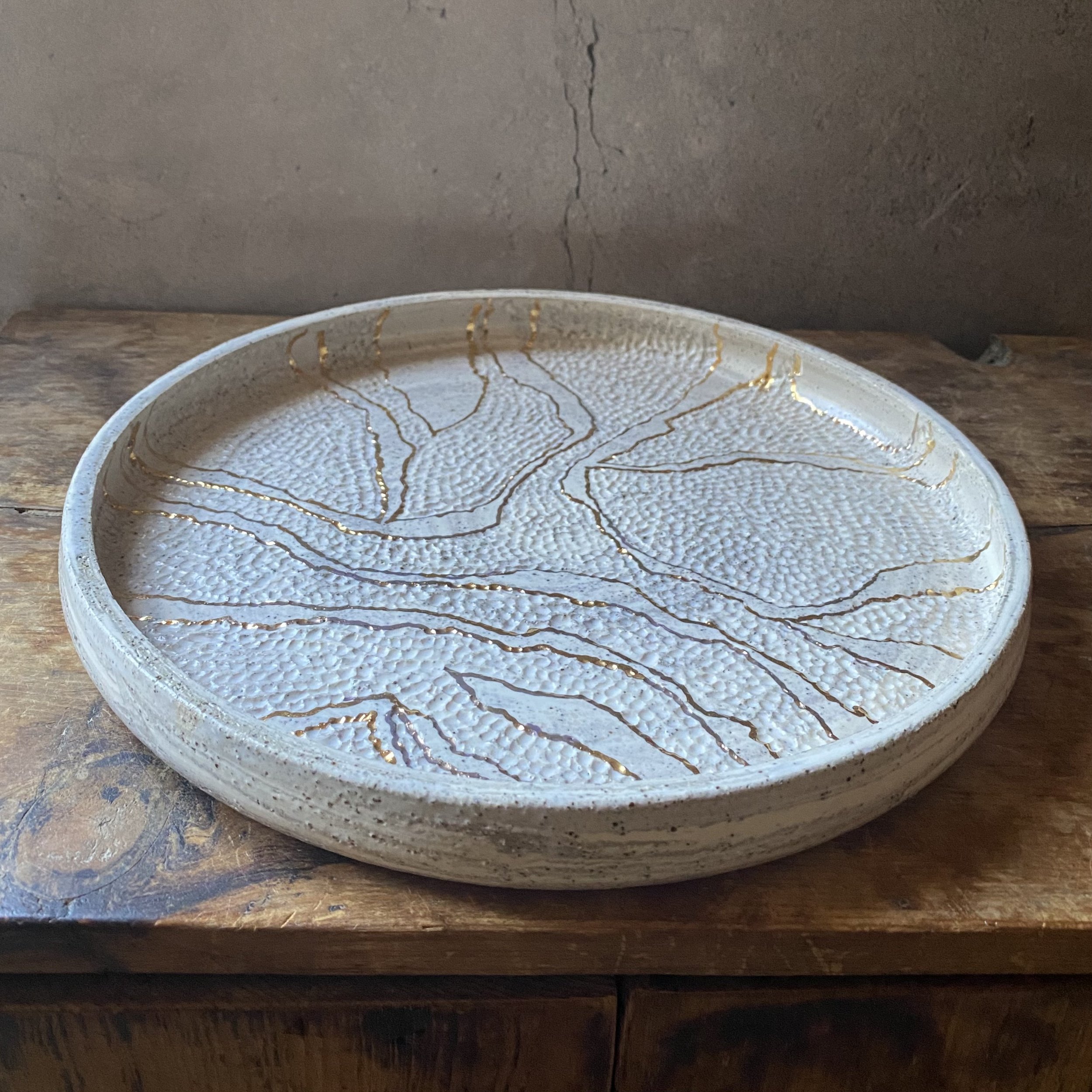 Unearthed handmade ceramic dish with gold lustre and handcarved