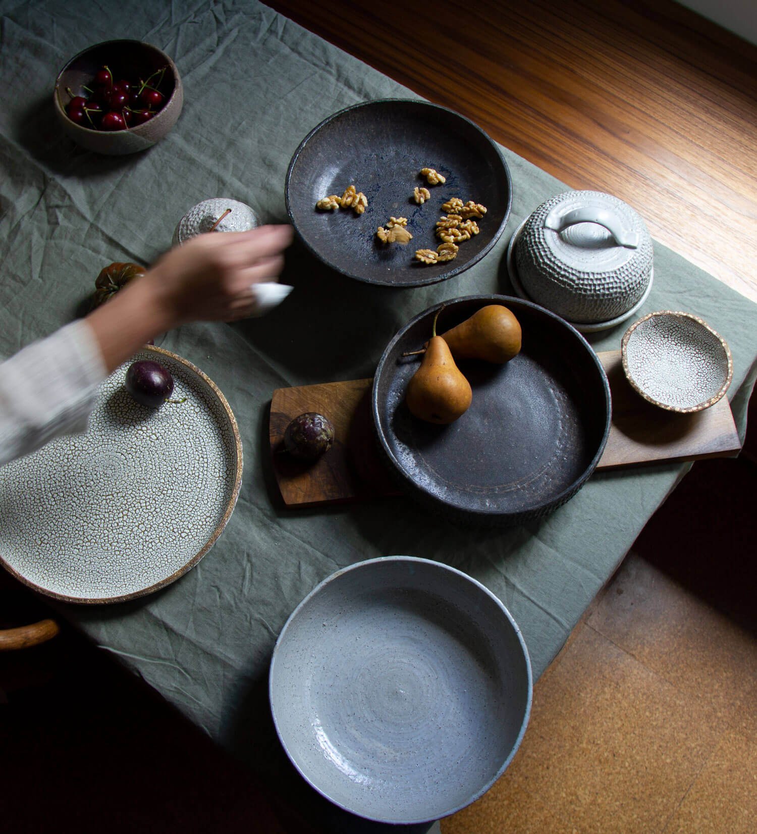 hands over ceramic sharing bowls