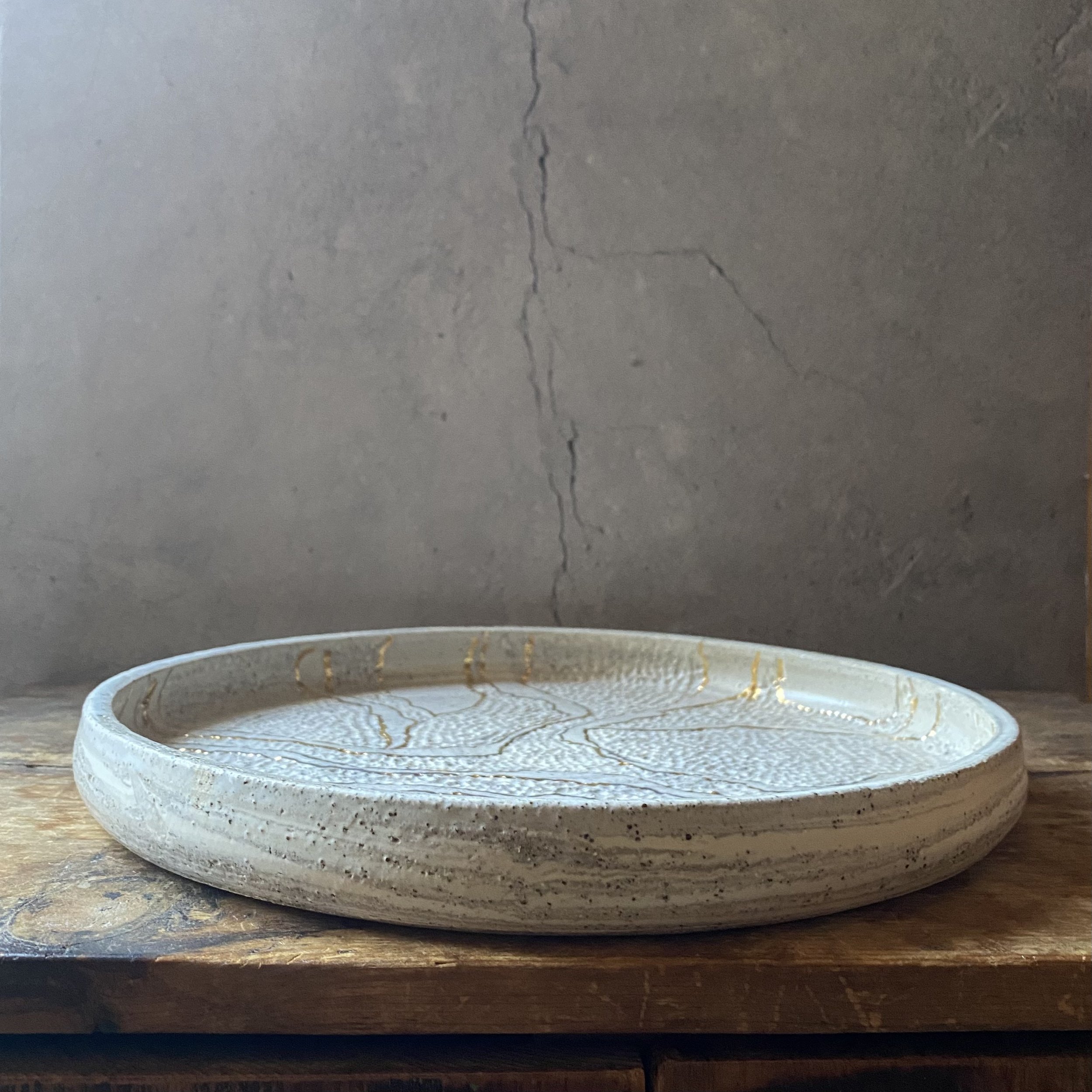 Unearthed handmade ceramic dish with gold lustre and handcarved