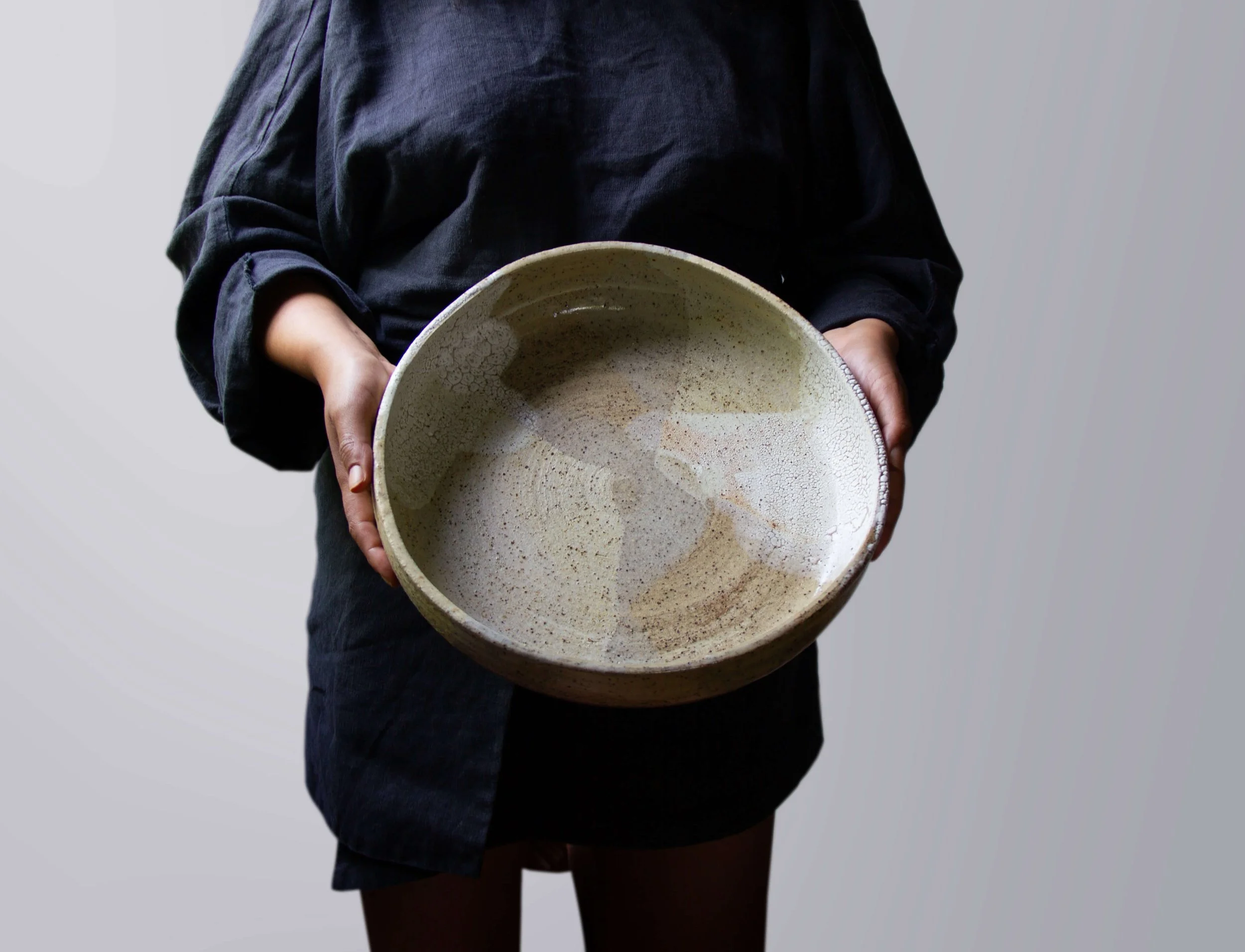 person holding large bowl