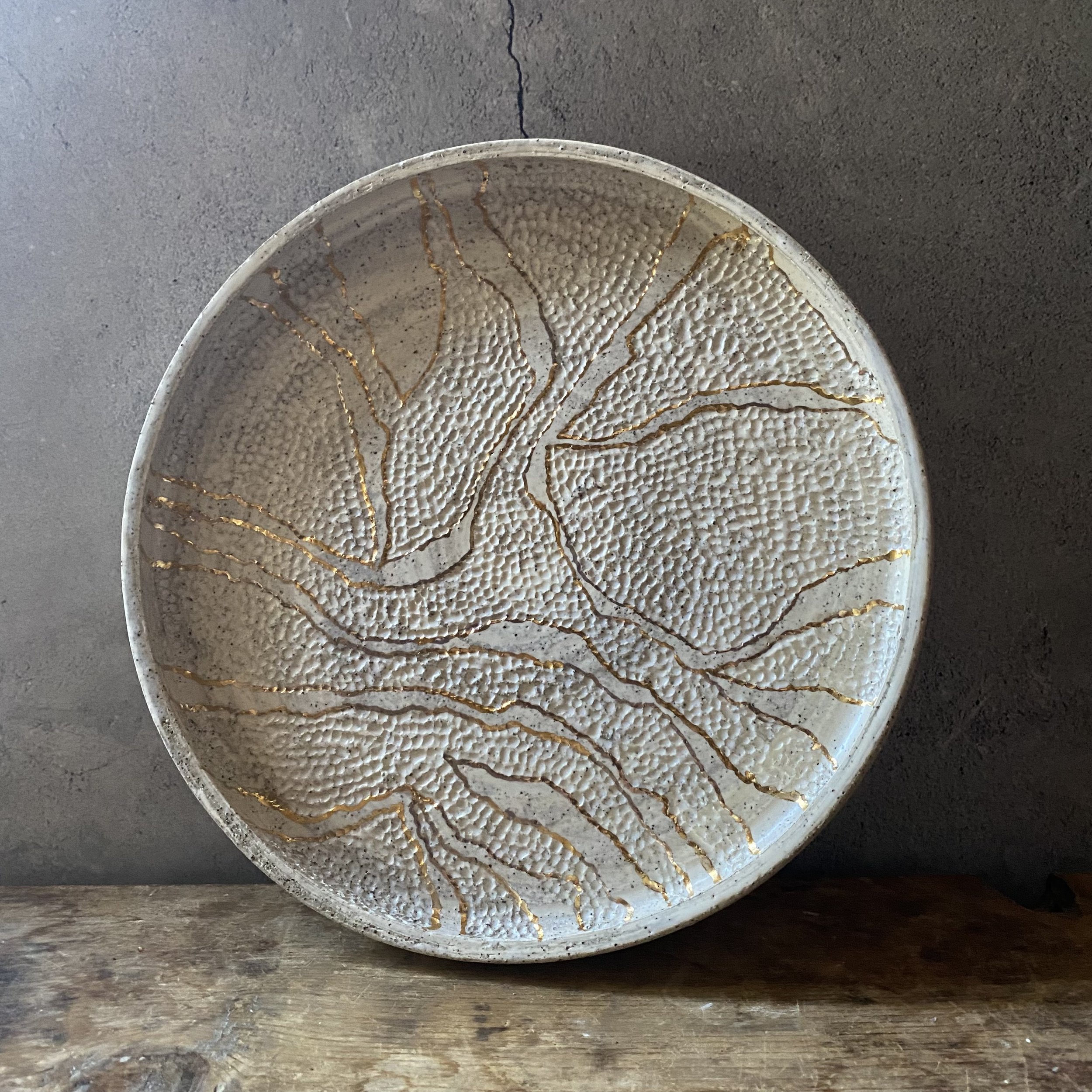 Unearthed handmade ceramic dish with gold lustre and handcarved