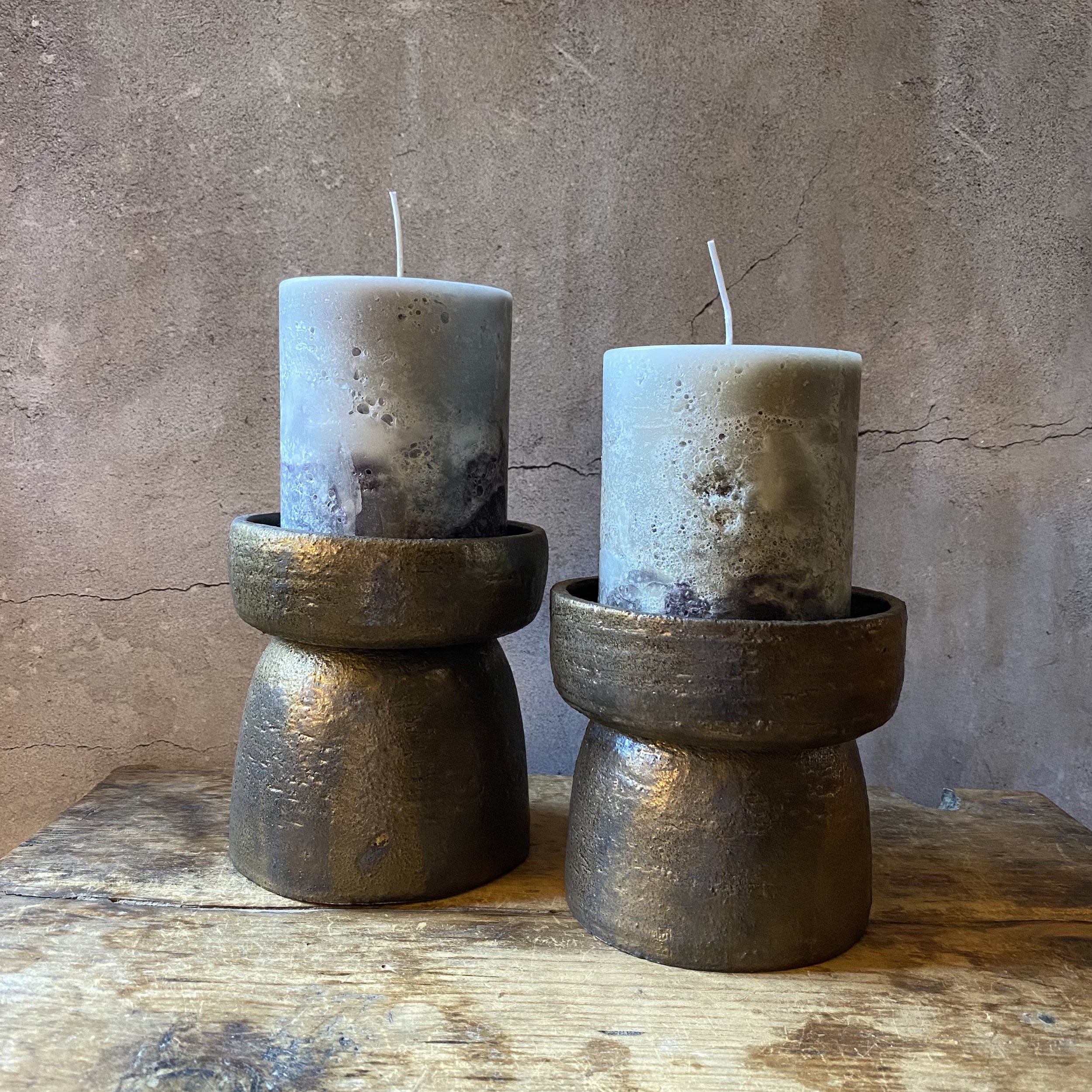 Unearthed handmade ceramic candlestick holders in bronze