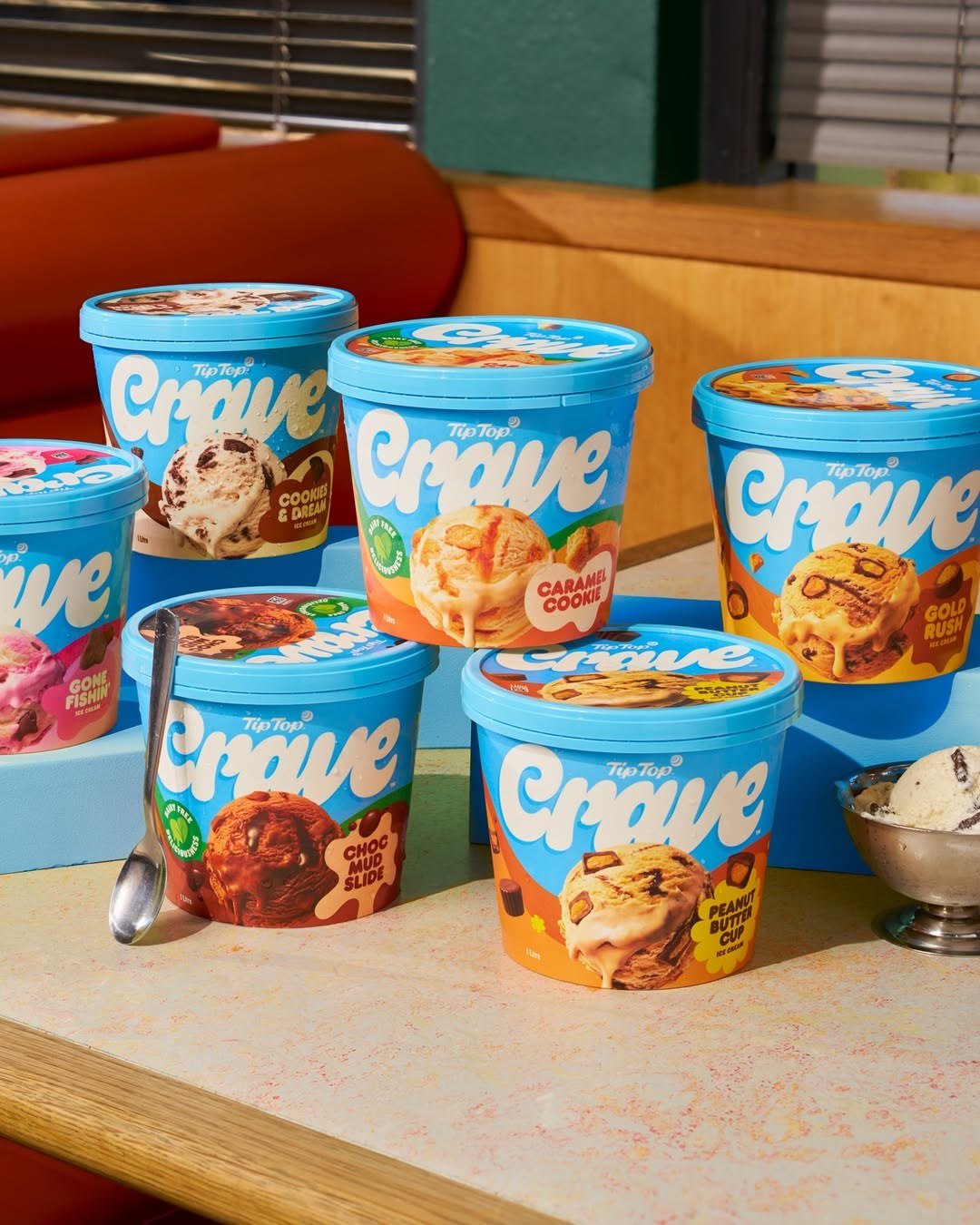 The Crave tub range grouped on a diner counter with a scoop of ice cream