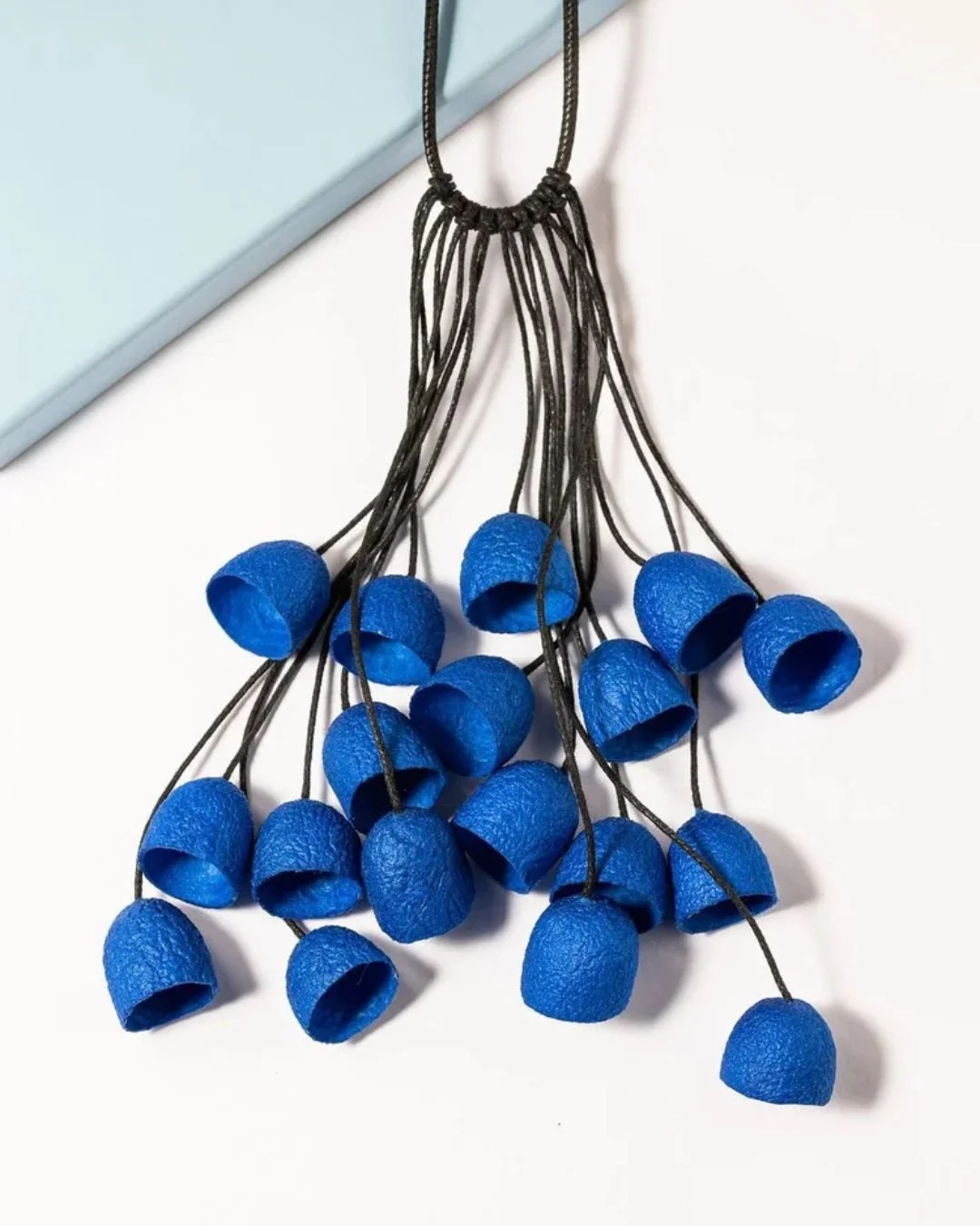 Light as air, soft as memory.
Handmade in Florence by Gulnara, each necklace is crafted from real silkworm cocoons &mdash; dyed, shaped, and strung by hand to honor the city&rsquo;s ancient silk tradition.

A piece that carries transformation within 