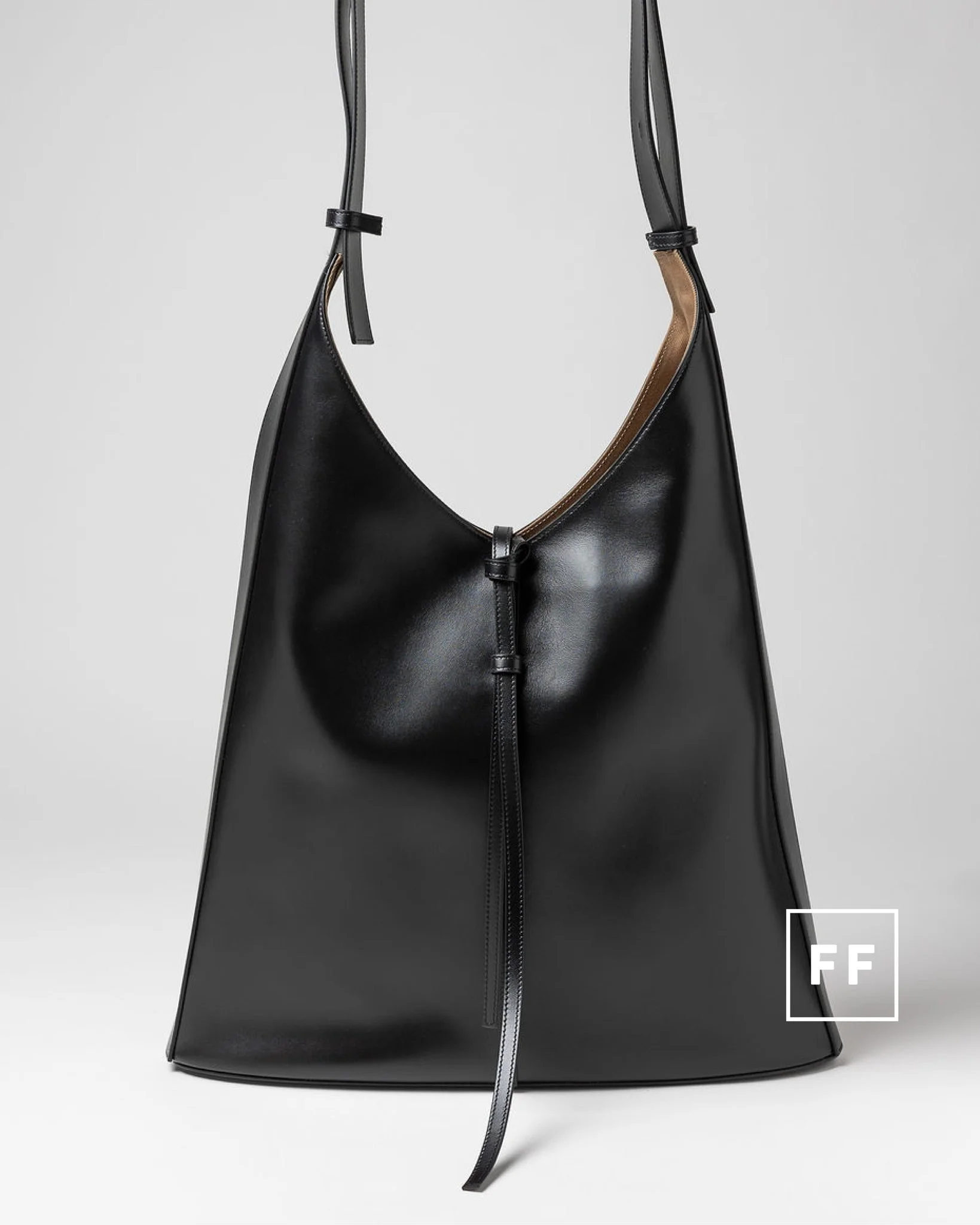 For days when &ldquo;just the essentials&rdquo; includes a laptop, notebook, agenda and several other entirely reasonable necessities.

This spacious leather hobo features an adjustable strap for shoulder or crossbody wear, a drawstring closure and a