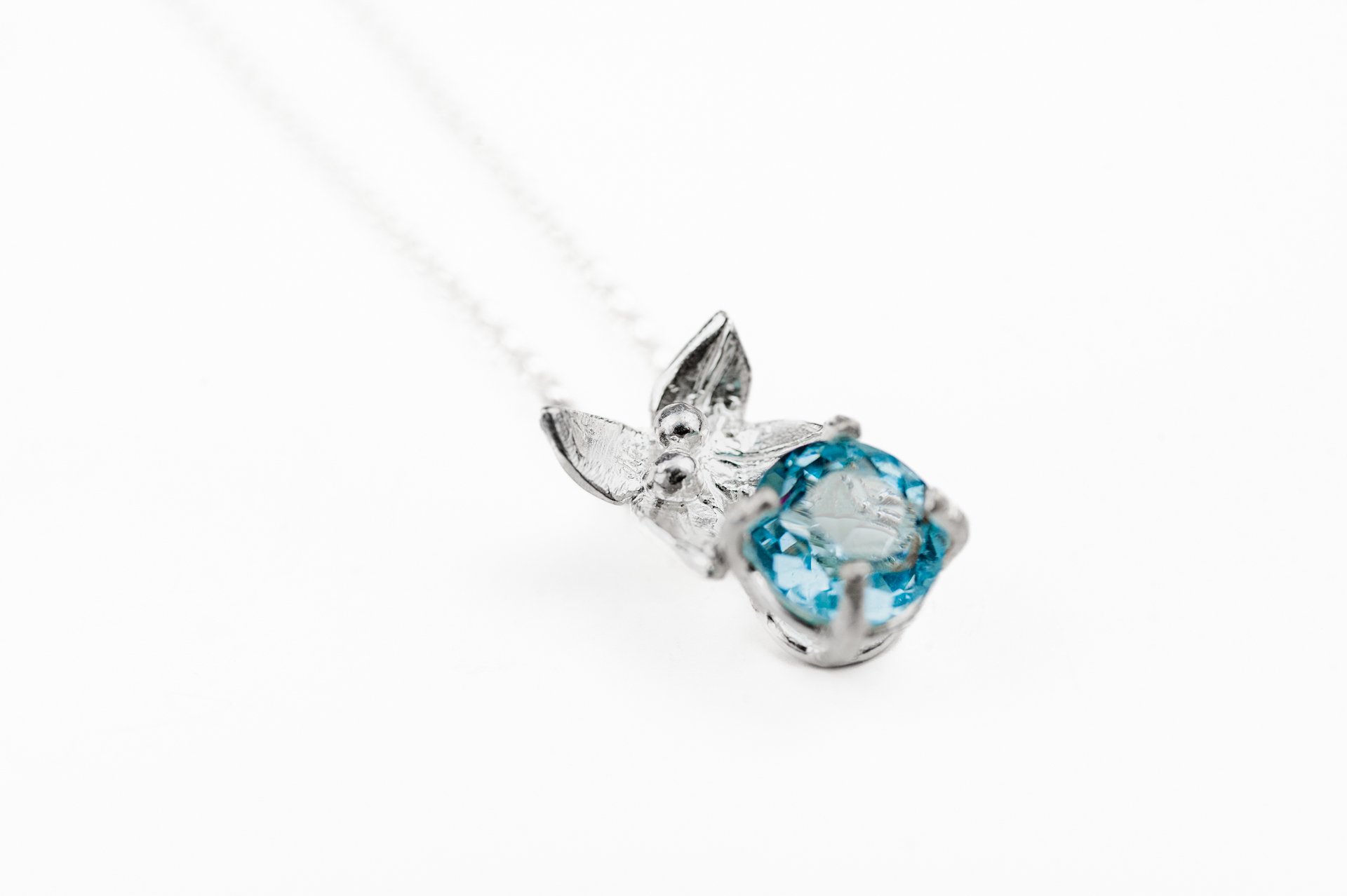Flower necklace with blue topaz