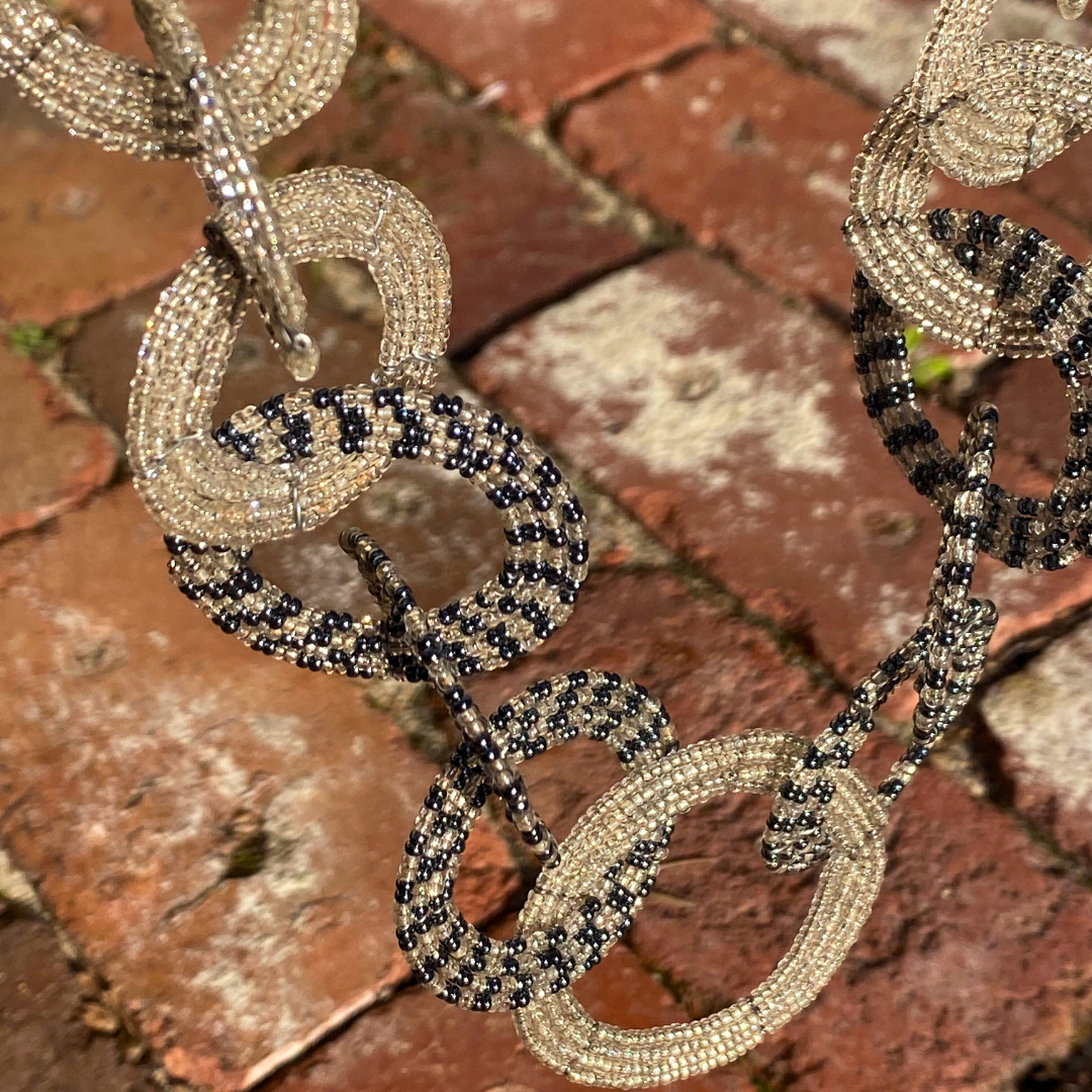 Beautiful hand beaded necklace from our Circle of Love series. Here in clear and blue beads. Originating from Mkuru in Northern Tanzania.