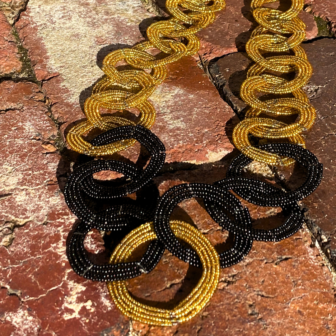 Beautiful hand beaded necklace from our Circle of Love series. Here in gold and black beads. Originating from Mkuru in Northern Tanzania.