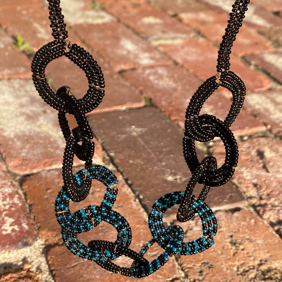 SS Circle on a string Black and black blue  v3.png