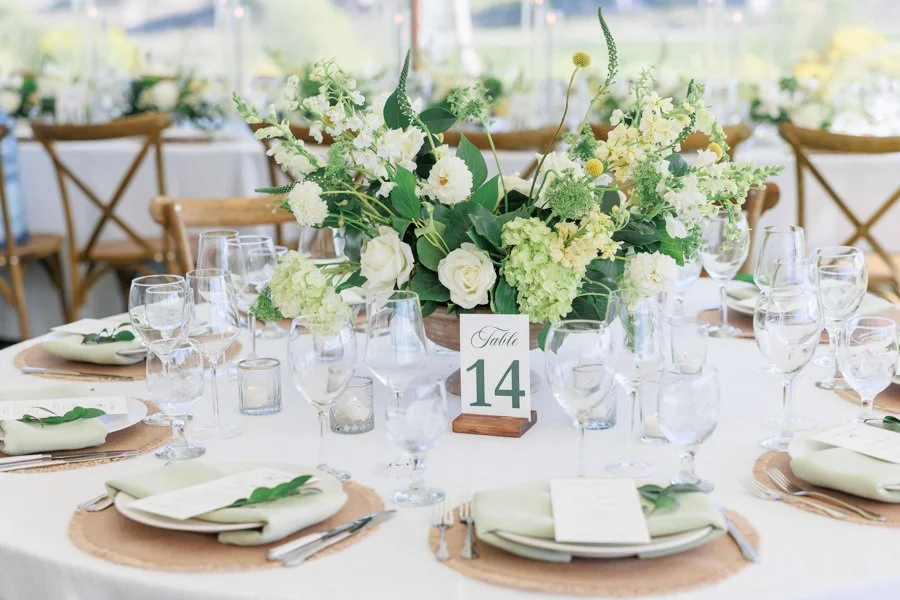 Wedding reception table design with floral centerpieces and place settings by Duet Weddings and Events, a Utah wedding planner