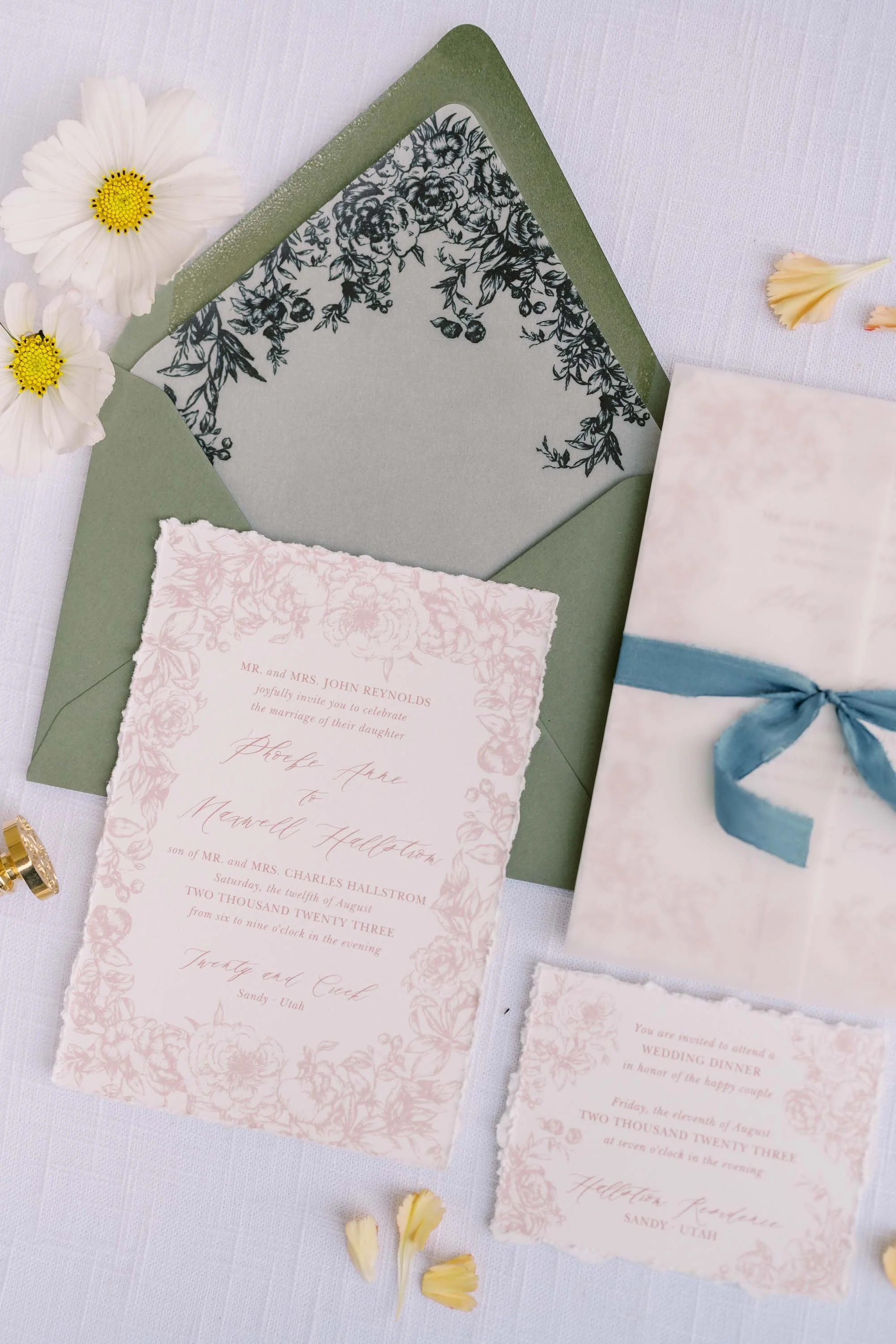 Flat lay of romantic wedding stationery and paper details curated by Duet Weddings and Events, a Utah wedding planner