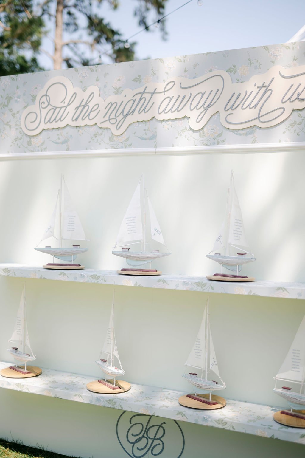 Wedding seating chart sailboat models with printed guest lists by Hartsy Designs at Oldfield South Carolina