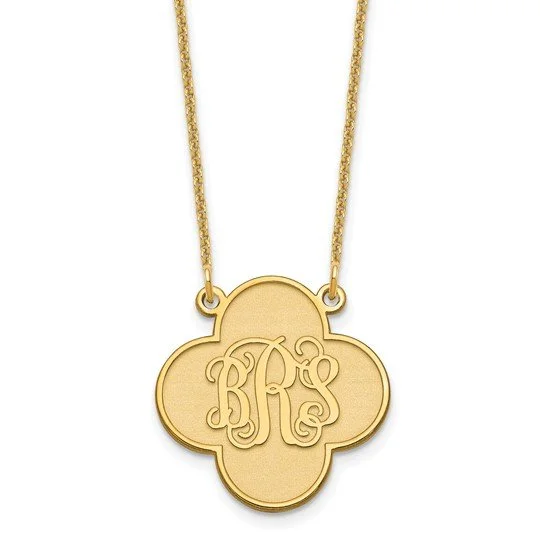 Gold pendant necklace with a four-leaf clover shape and engraved initials RKS.