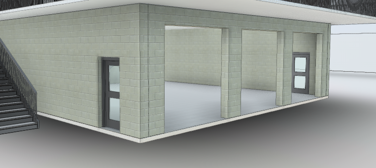 Empty, unfinished commercial space with two doorways and an exterior staircase.