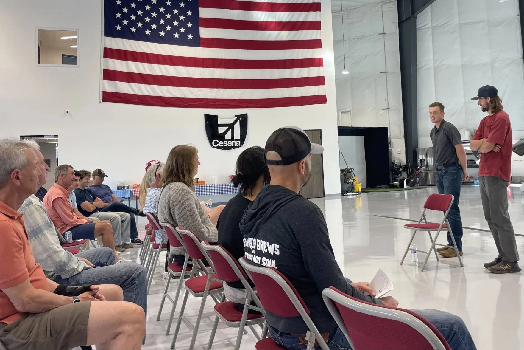 Adam Bunker, standing, in gray polo shirt, answers questions during an open house at the Heber Valley Airport June 1, 2026.