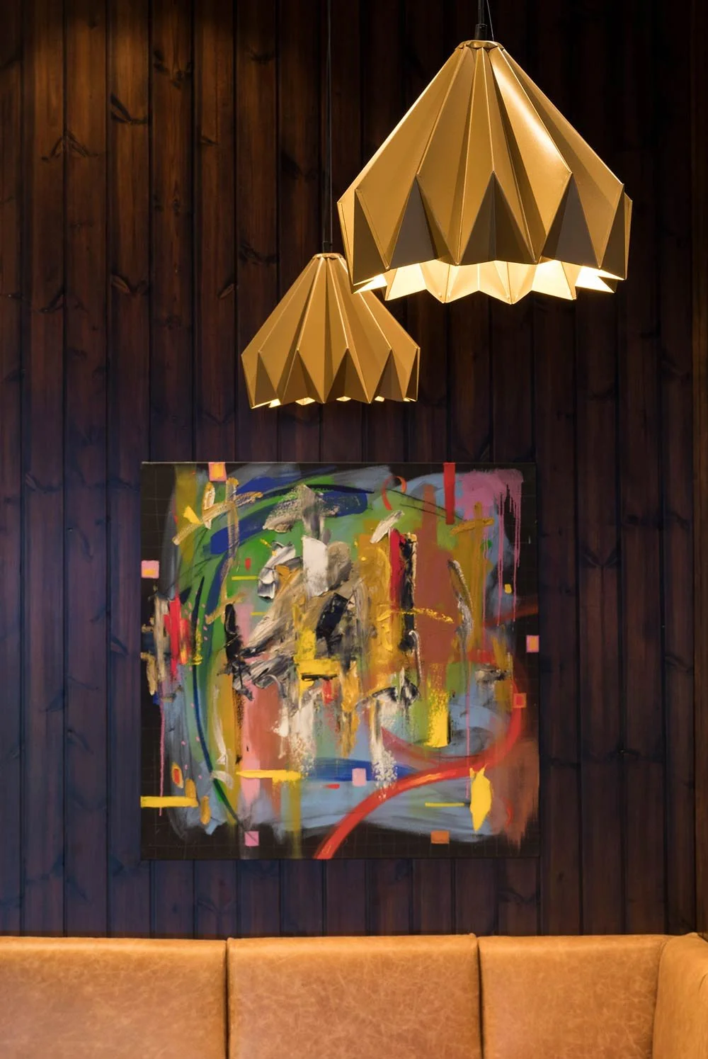 Nando's pendant lights with painting in the background