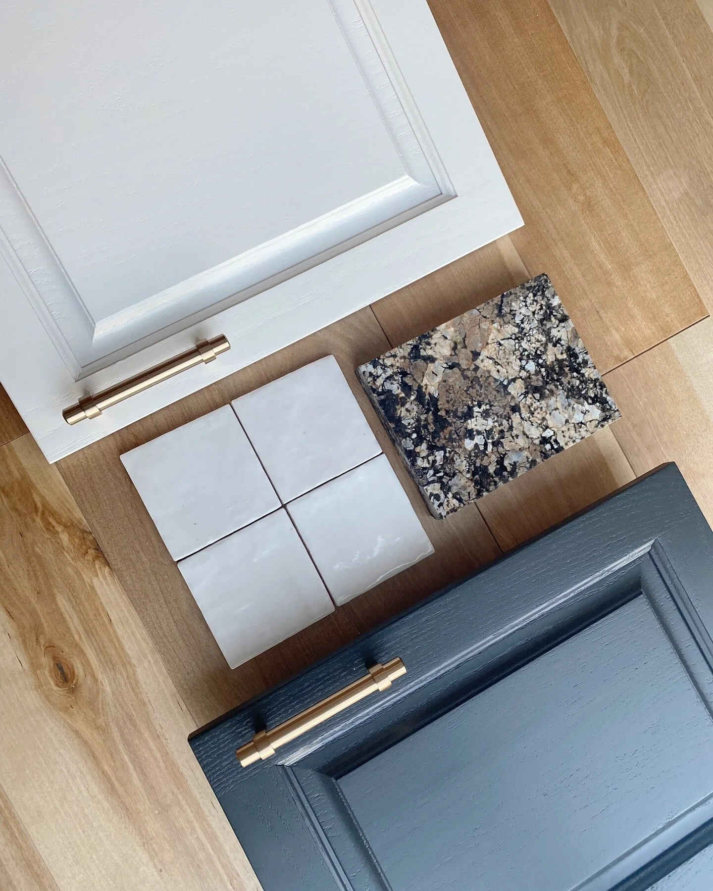 For our Hopkinton project, our client wanted to refresh their kitchen, while keeping their existing oak cabinets and granite counter tops. 
We decided to do a black lacquer on the lower cabinets and off white on the uppers. We also selected a classic