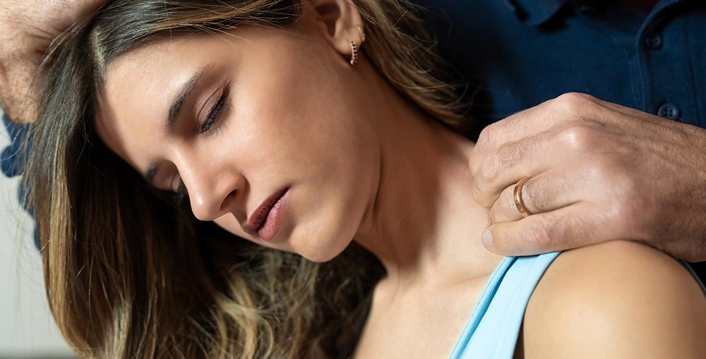 Registered massage therapist treating patient’s neck pain after motor vehicle accident at West End Wellness in Vancouver.