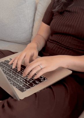 branding founder typing on computer working with women-led wellness coaches