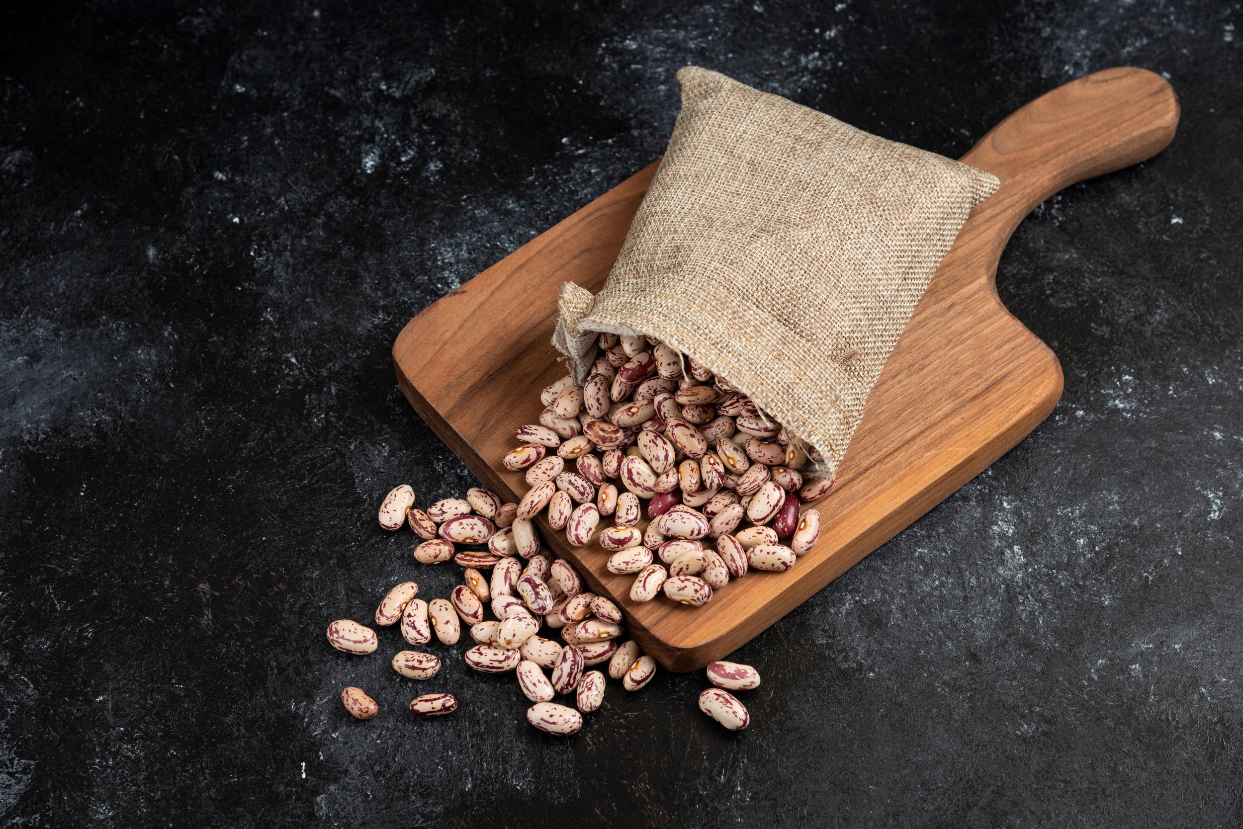 sackcloth-dried-raw-beans-placed-wooden-board.jpg