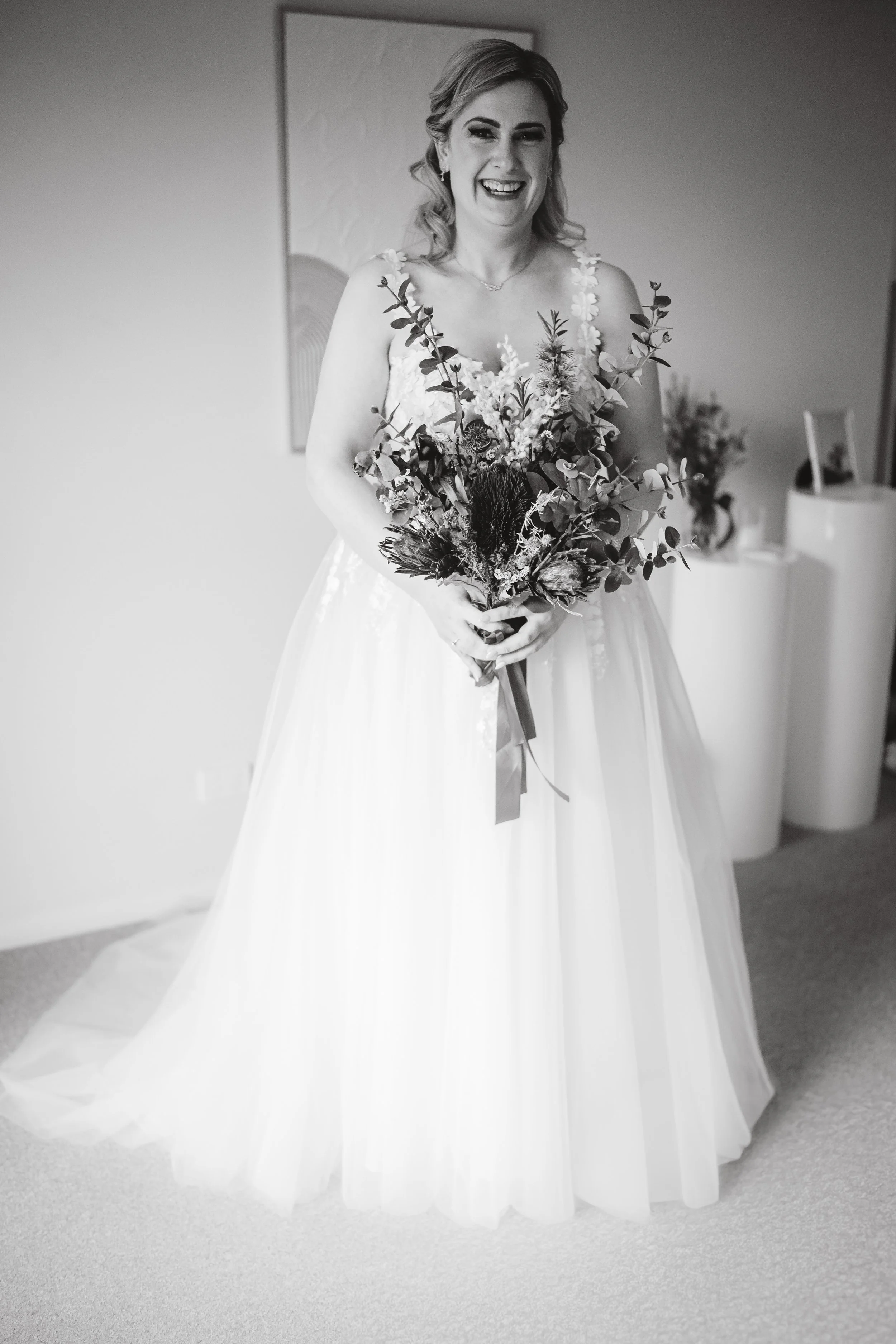 Bride holds her native bouquet at home in Penrith before her wedding at Settlers, Mulgoa