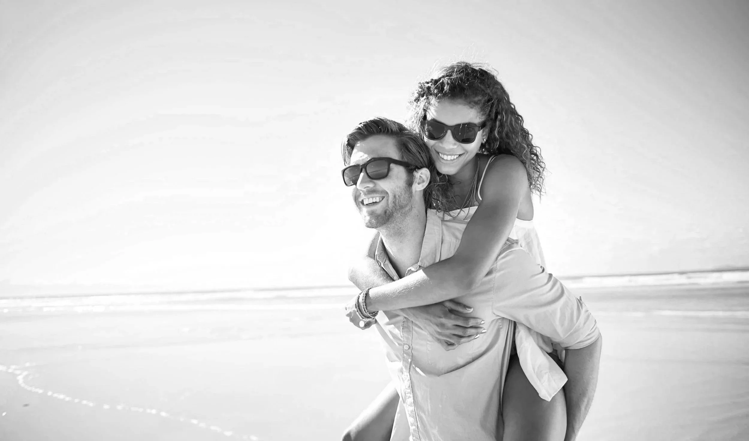 Lady being carried on beach in sun