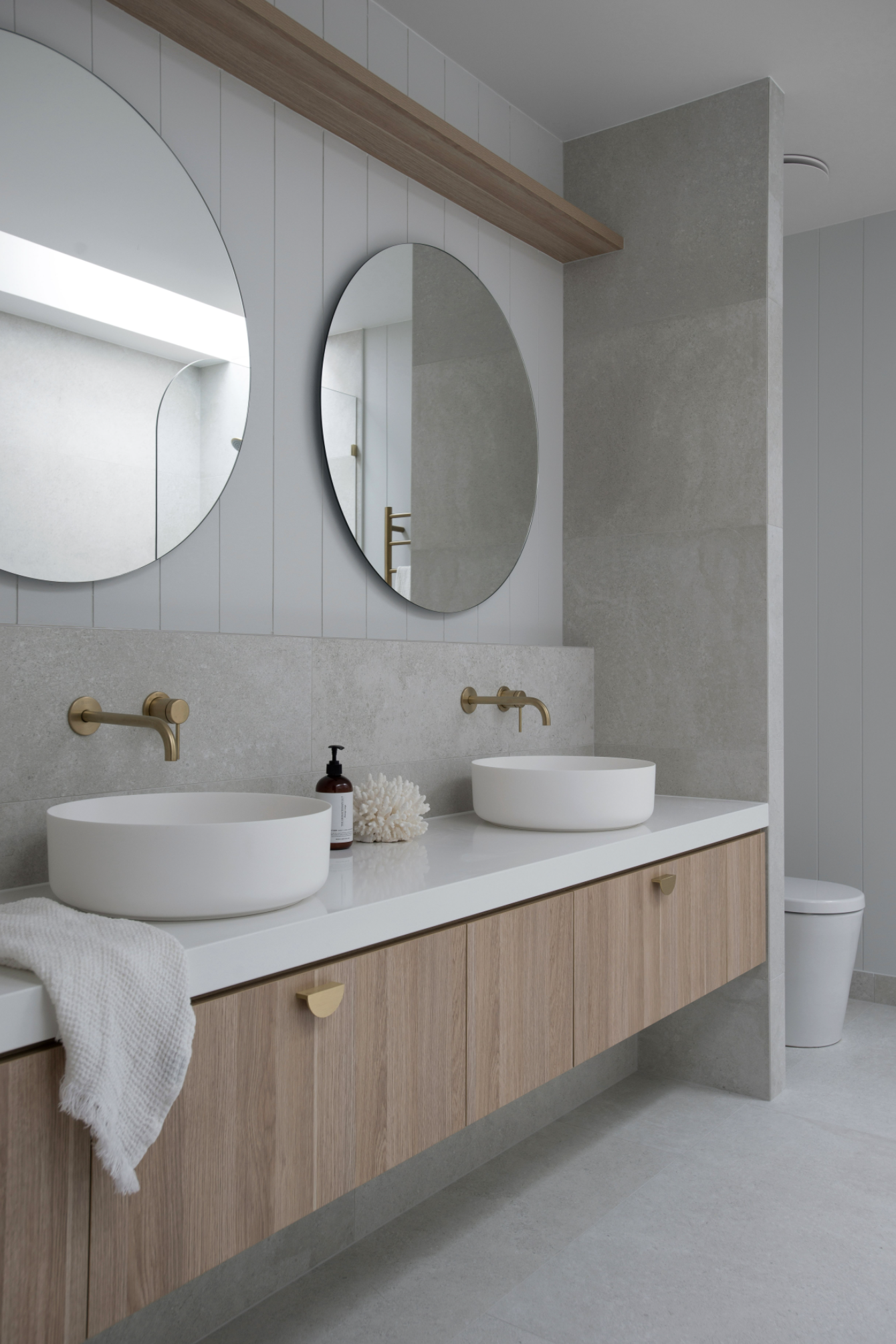 Twin Timber Vanities with two round bathroom vanity mirrors and grey tiles in classic coastal bathroom design bundle for home renovation Brisbane