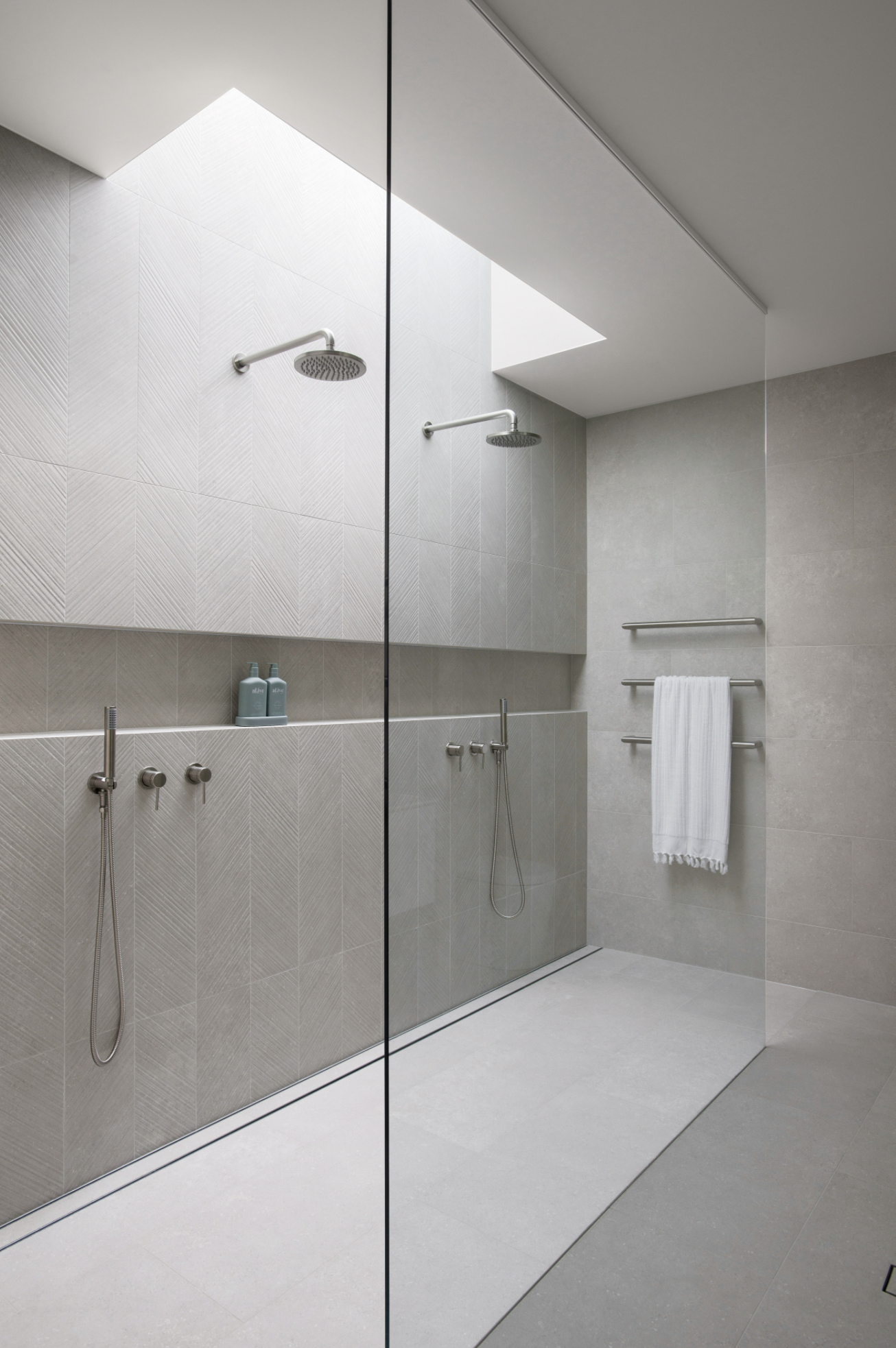 Shower niche design with greige bathroom tiles and glass shower screen in contemporary home design guide for bathroom renovation