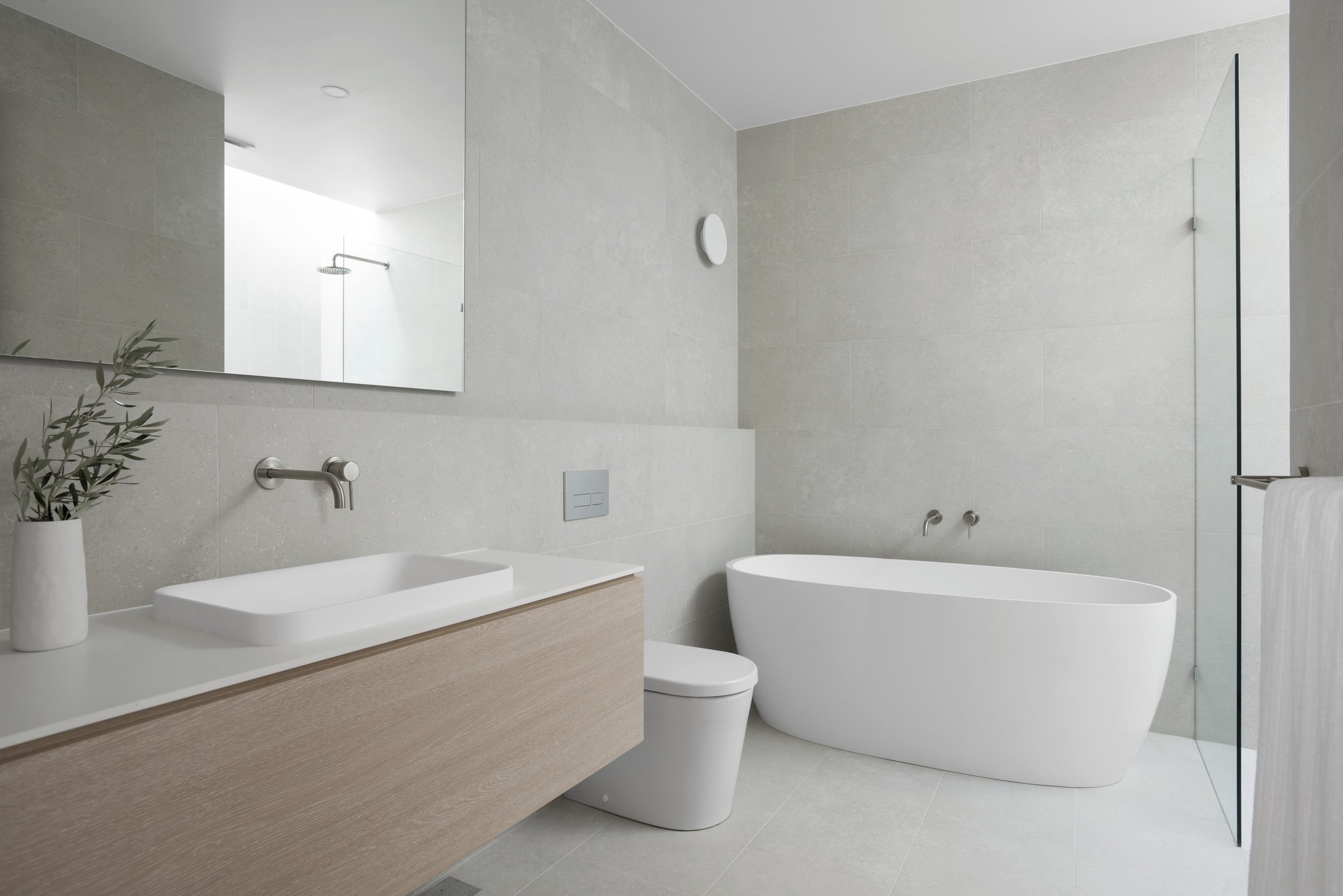 Big bathroom vanity mirror and freestanding white bathtub and inwall toilet with regie bathroom tiles design for bathroom renovation
