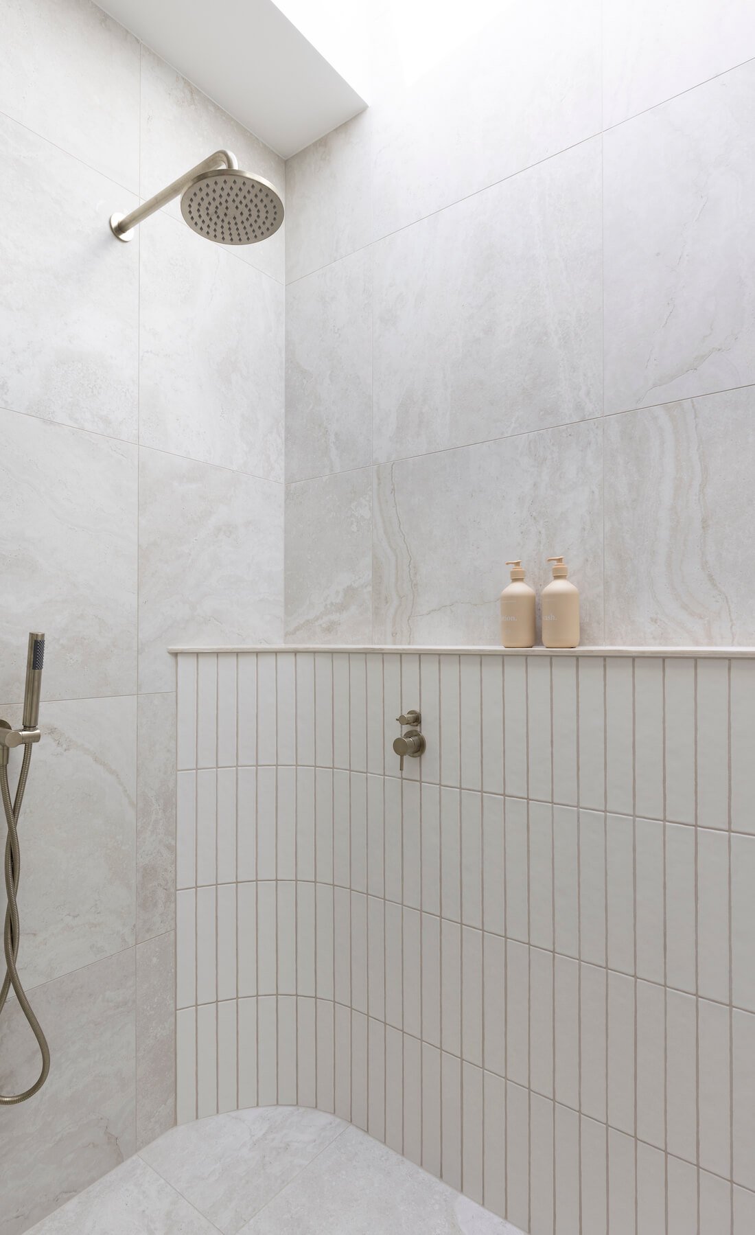 Shower with curved shower ledge