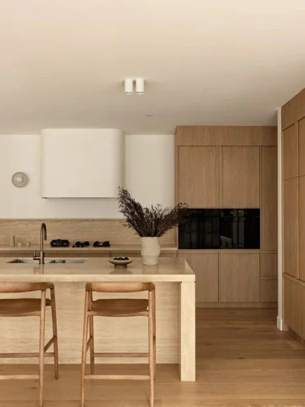Timber kitchen with island bench seating and full-height cabinetry