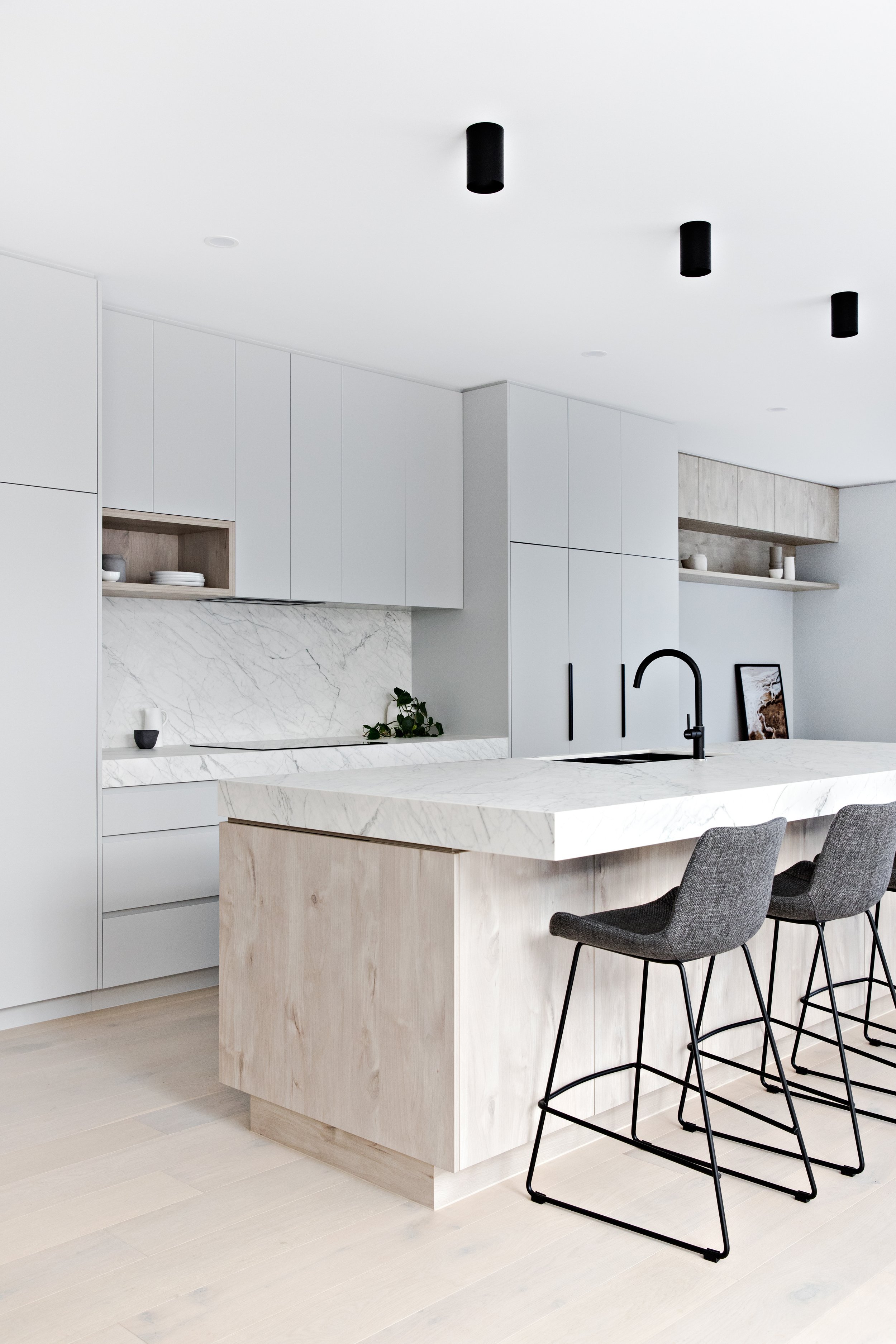 Scandi kitchen design with natural stone kitchen island benchtop