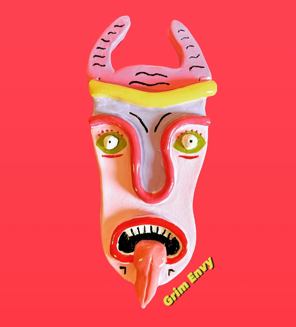 Colorful mask with exaggerated facial features, including green eyes, red lips, and a tongue sticking out, with horn-like shapes on top and black markings on a red background. The text 'Grim Envy' appears in yellow at the bottom.