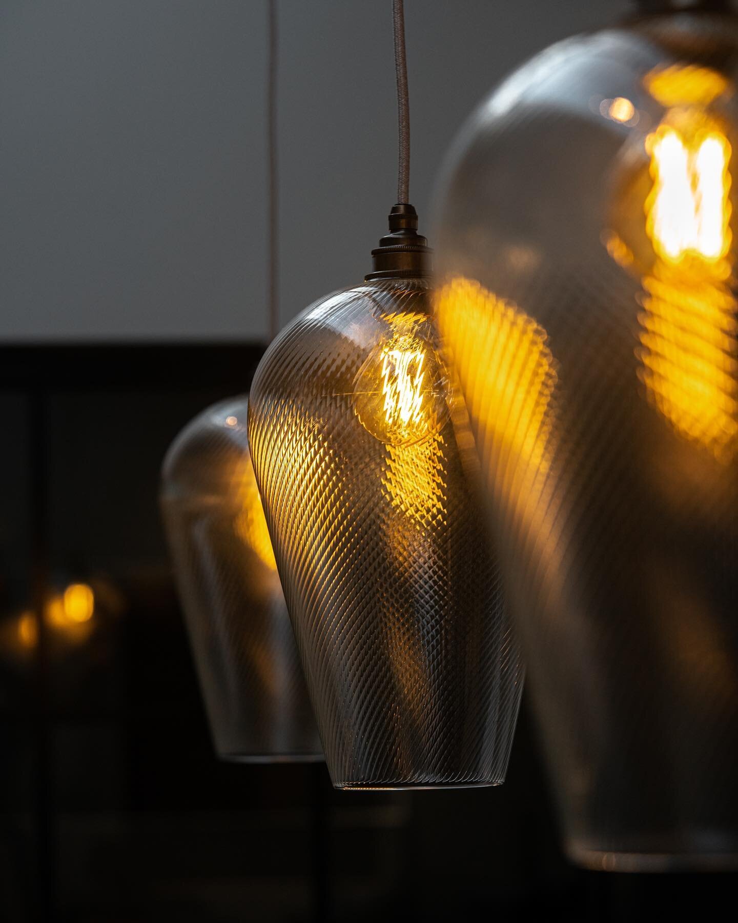 Our new trio of @leverintlighting Waterloo pendants suspended over the kitchen island in our Gloucester showroom.

Combining shades created in their very own glass-blowing studio in London with some Flicker Free @ray_lighting bulbs leads to a perfect