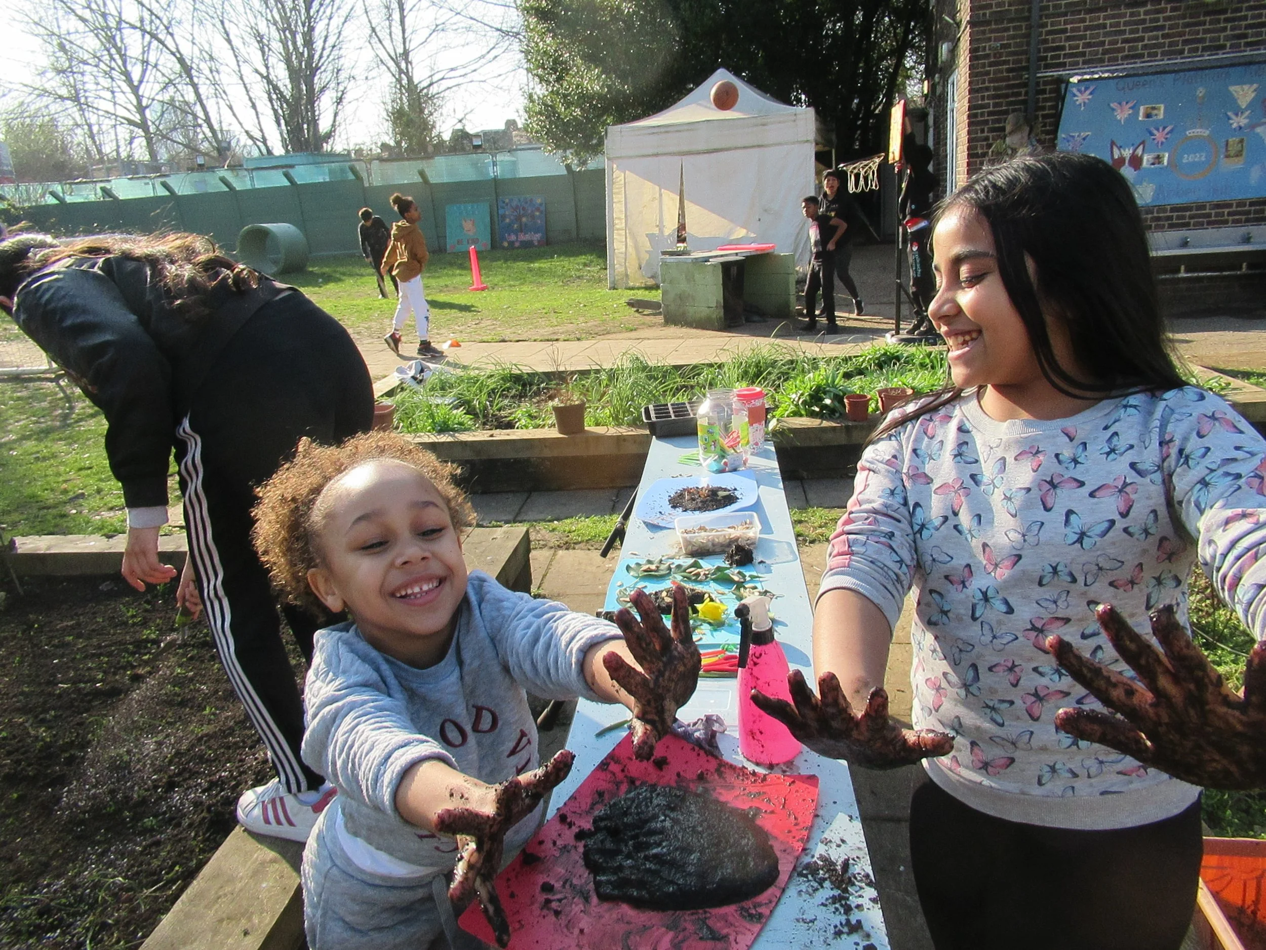 Careful sowing of a new wild garden and muddy fun.JPG