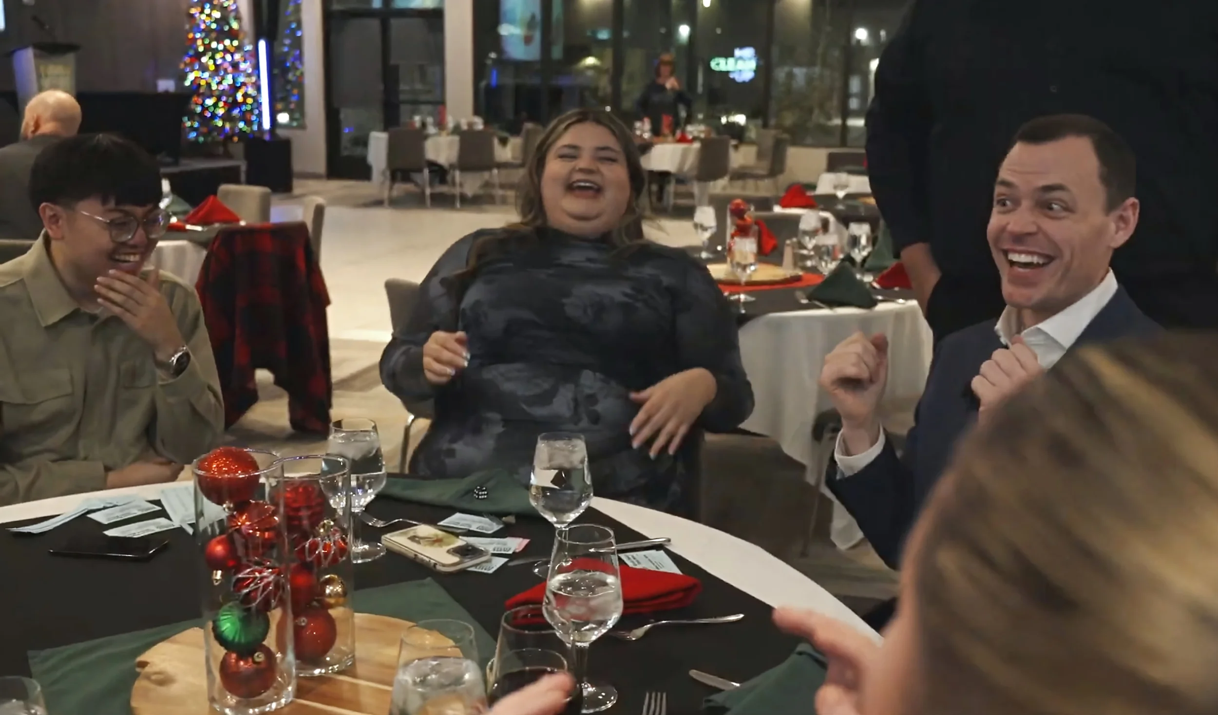 Winnipeg close-up magician Patrick Gregoire interacting with laughing corporate event guests
