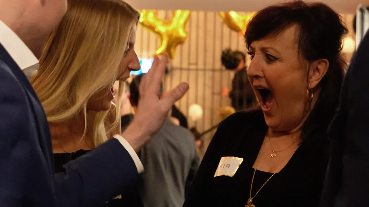 Guests reacting to close-up mentalism at a Winnipeg company Christmas party