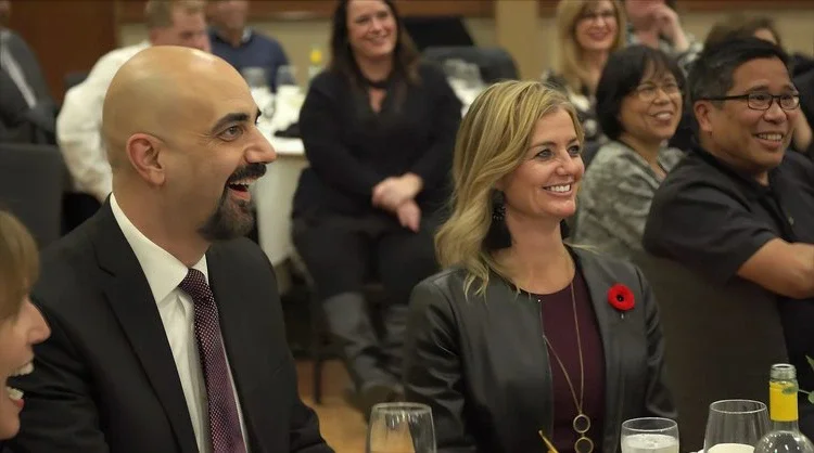 Winnipeg corporate audience smiling at Patrick Gregoire's magic show