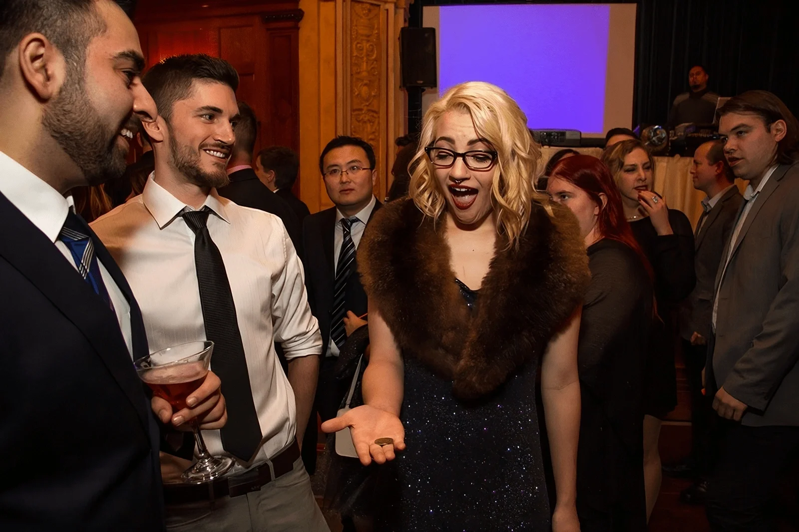 corporate event guest reacting with astonishment at a close-up magic trick by Winnipeg magician Patrick Gregoire